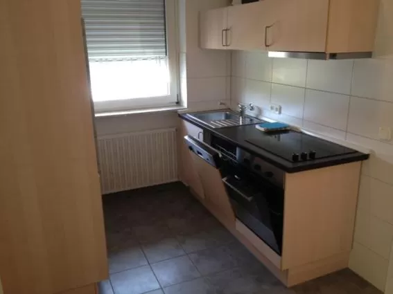 Kitchen or kitchenette in Gästehaus und Fewo Lamm Garni