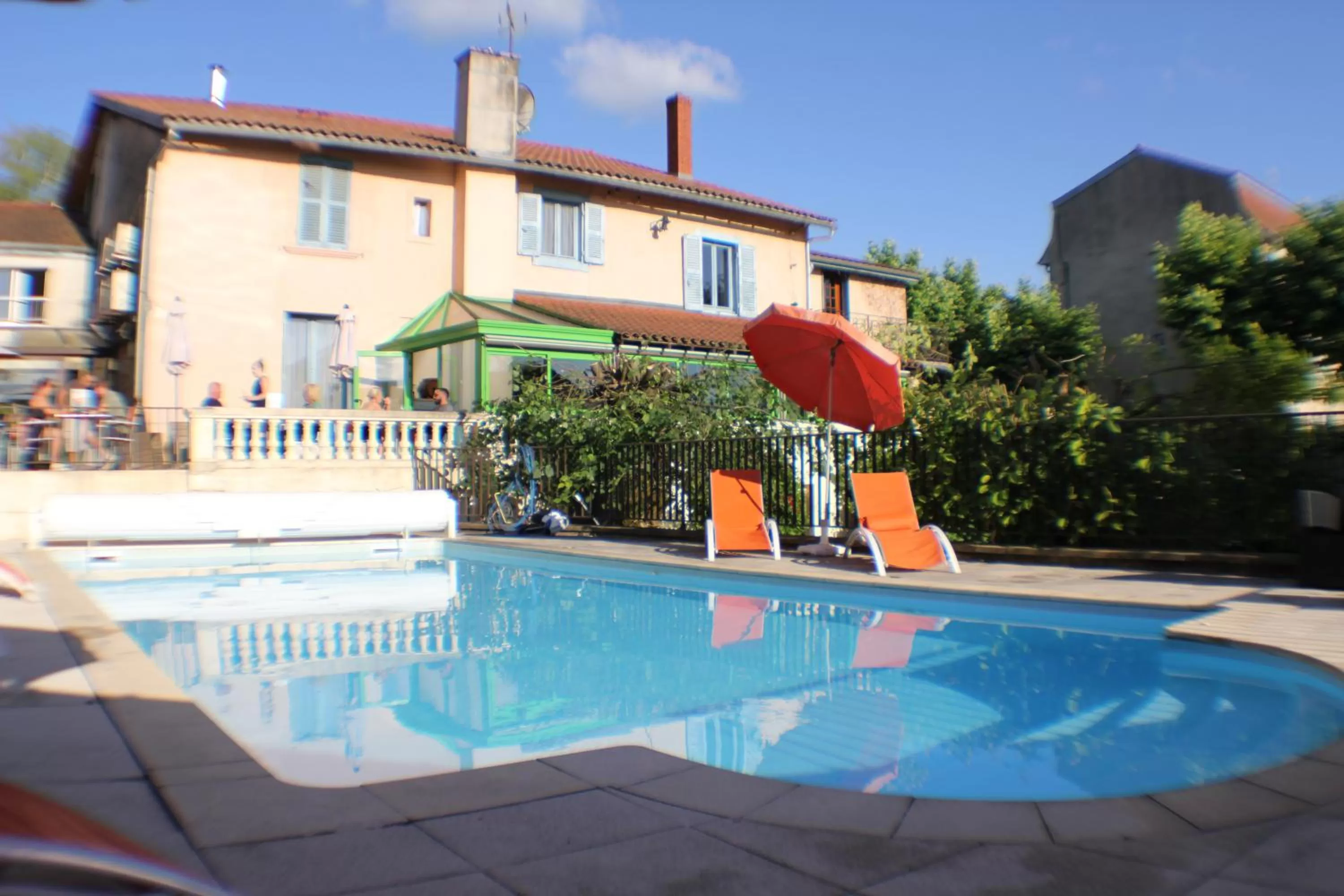 Swimming pool in Logis Hôtel Vuillot