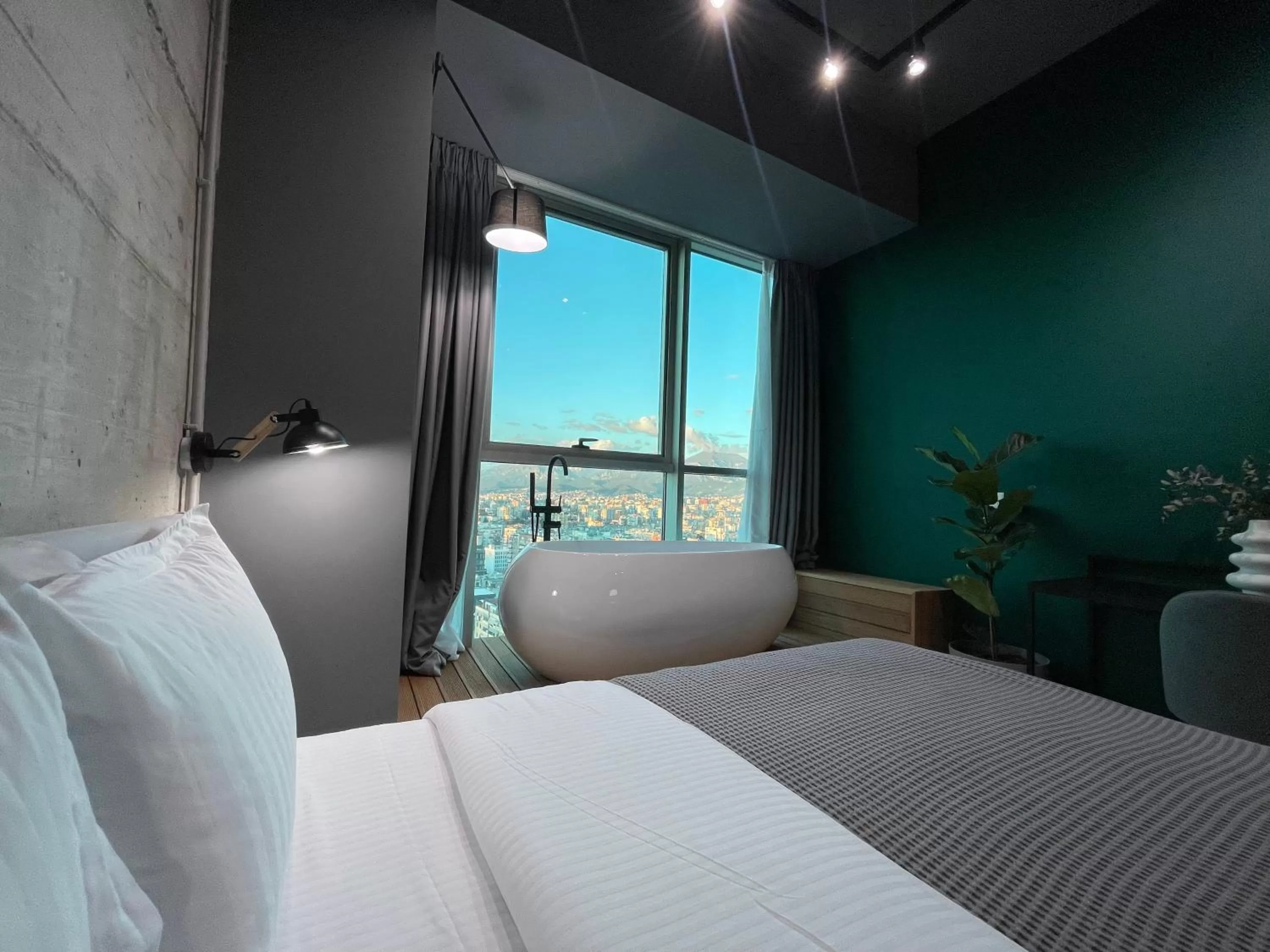 Bed in Ambassador Skyline Apartments