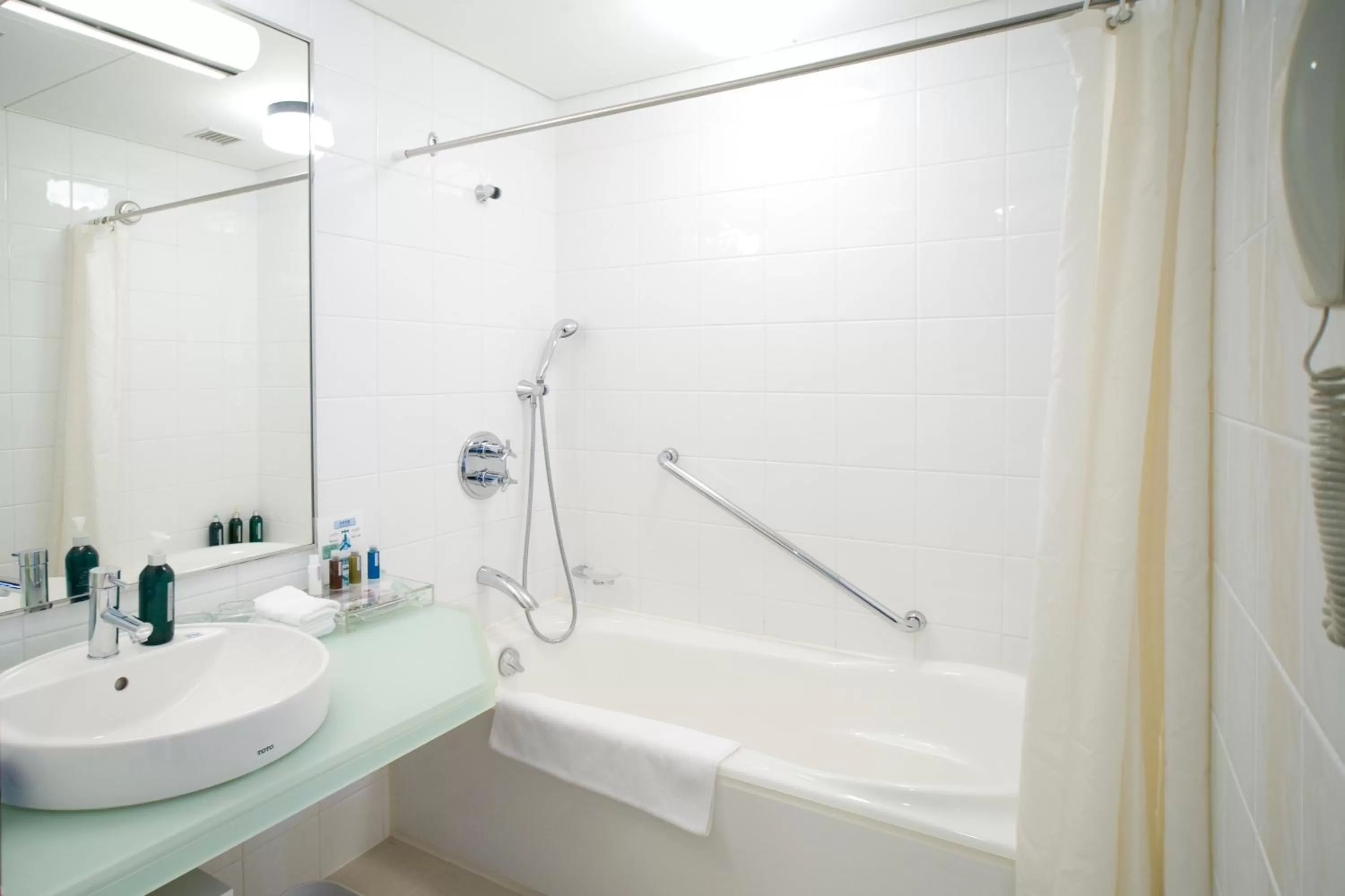 Bathroom in ANA Crowne Plaza Toyama by IHG