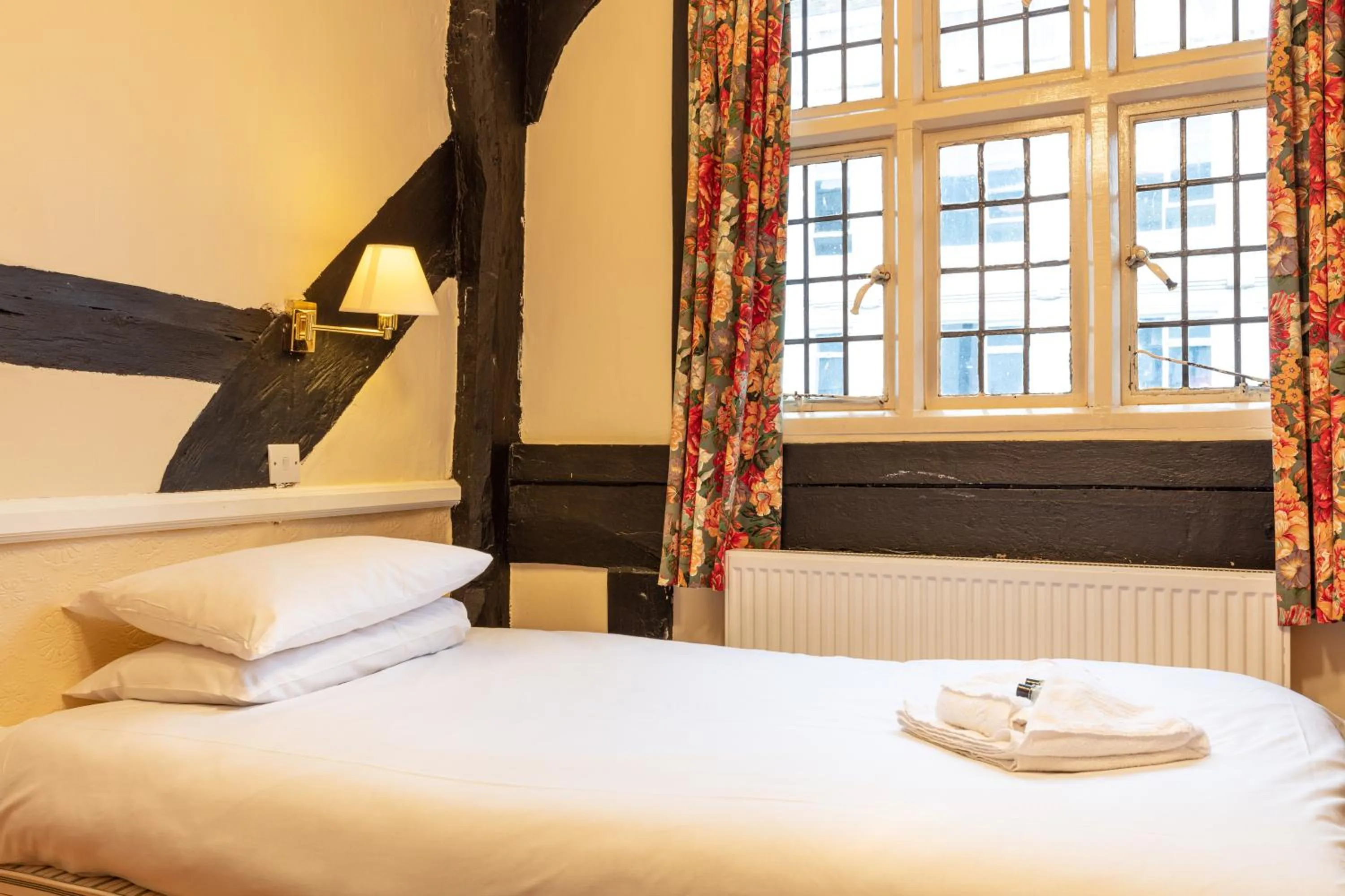 Bedroom, Bed in The New Inn by Roomsbooked