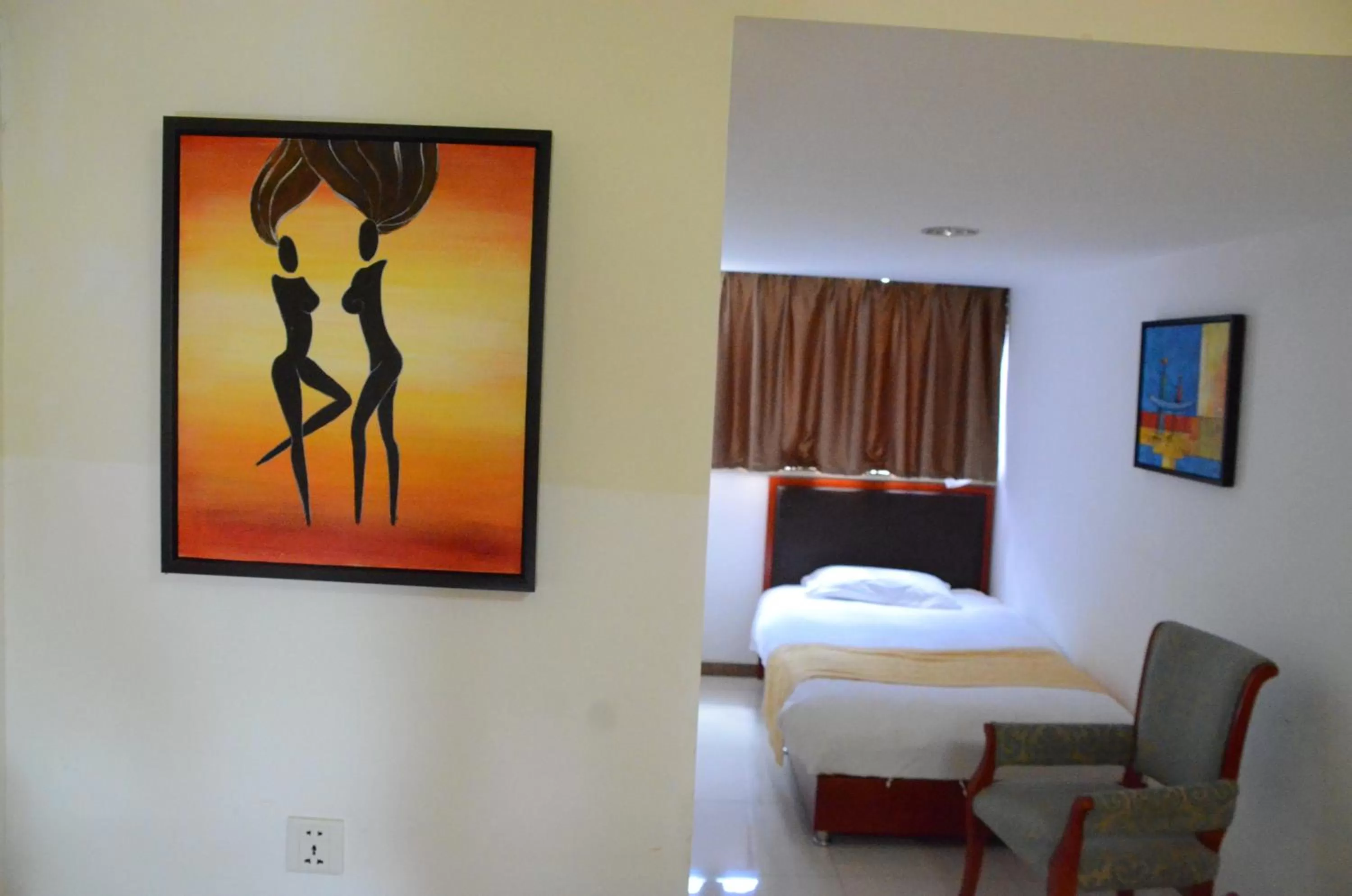 Bed in Soluxe Club International Hotel