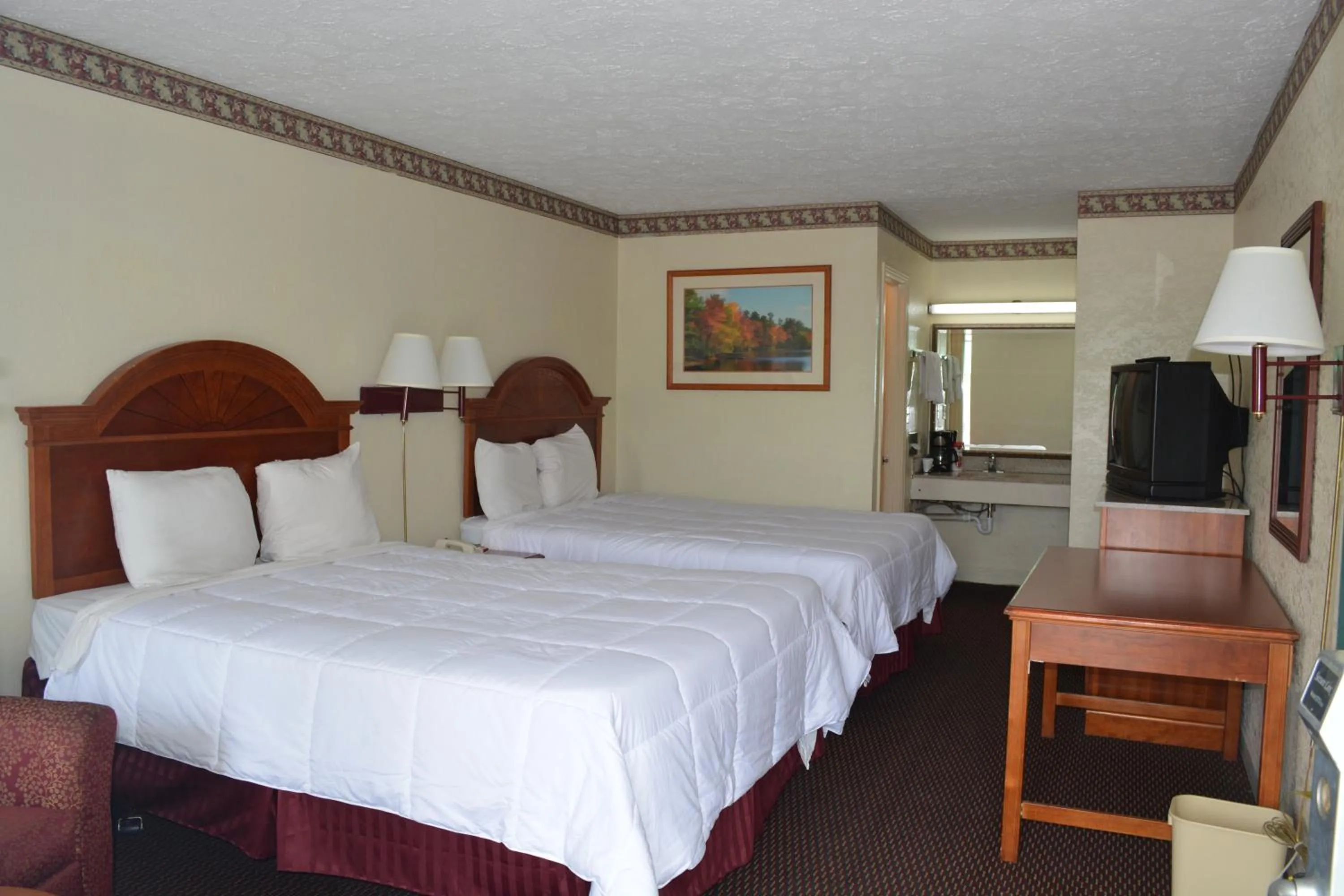 Bed in Knights Inn Hurricane Mills