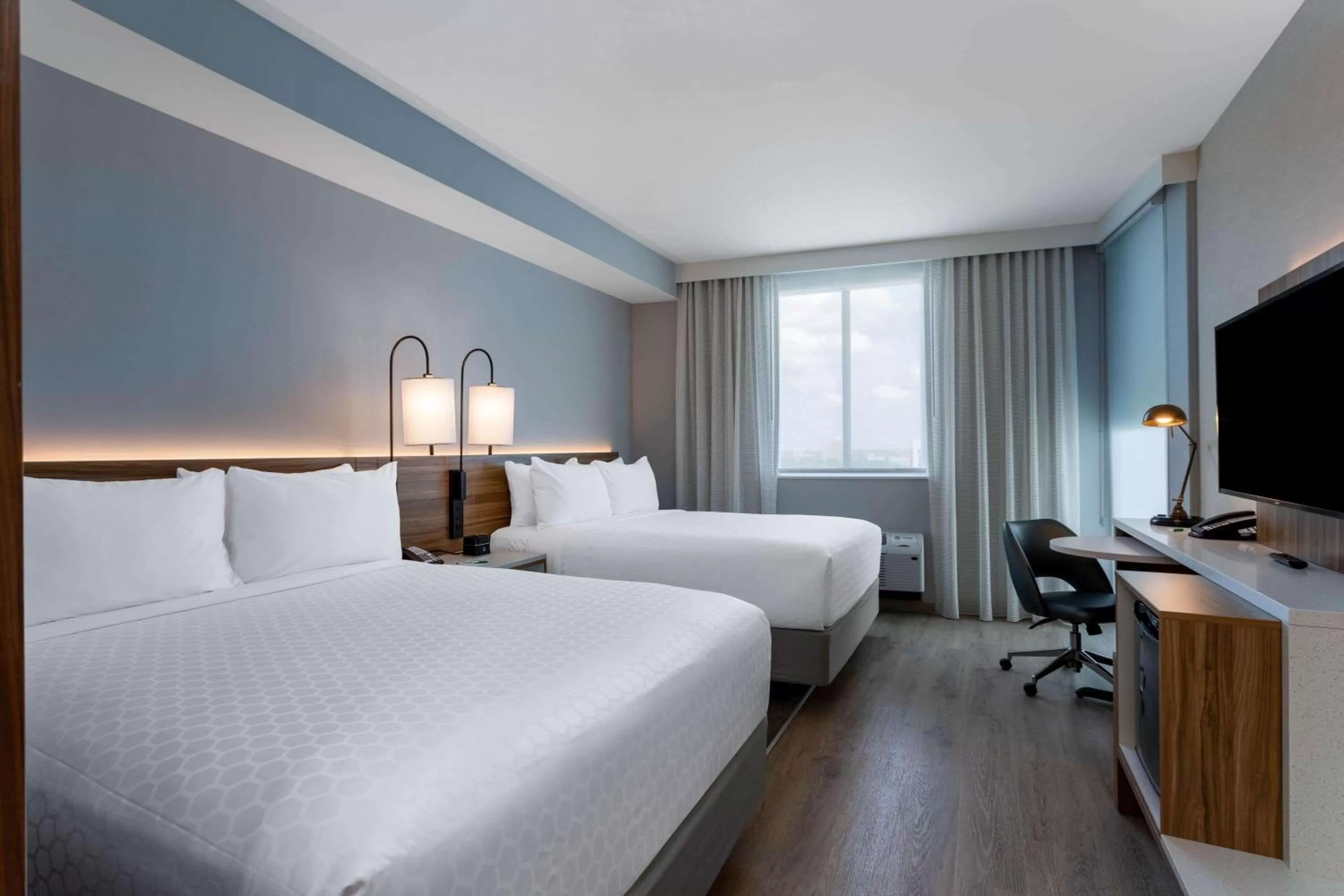 Photo of the whole room, Bed in Wyndham Garden Miami International Airport