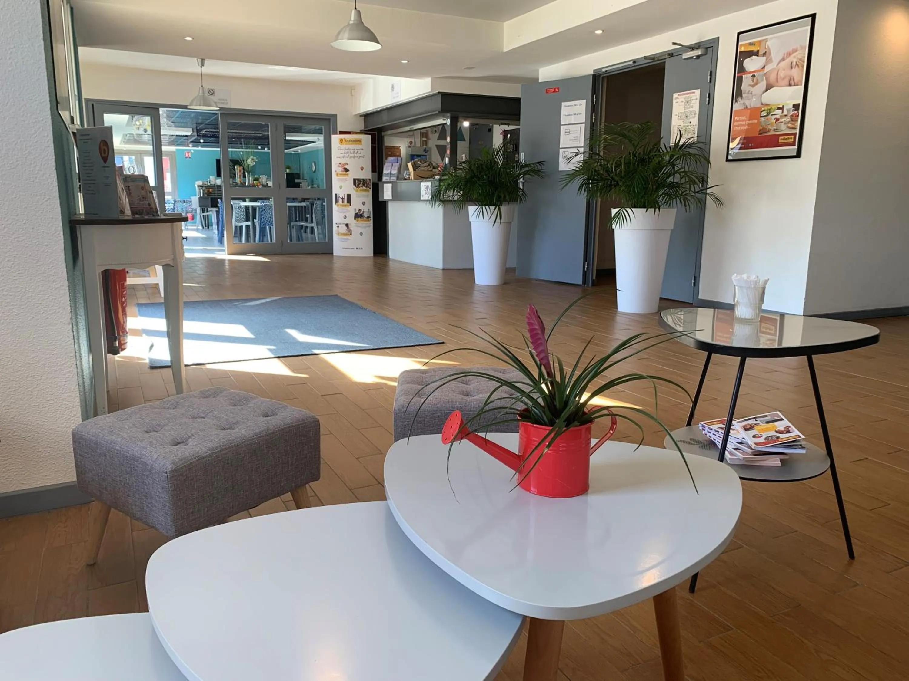 Lobby or reception in initial by balladins Tours Sud