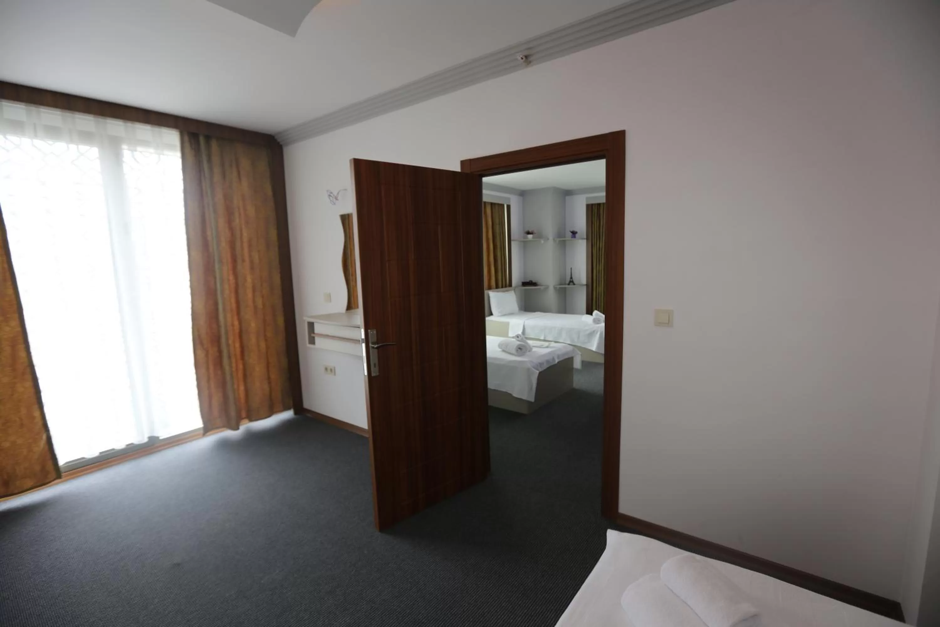 Bed in TEVETOGLU HOTEL