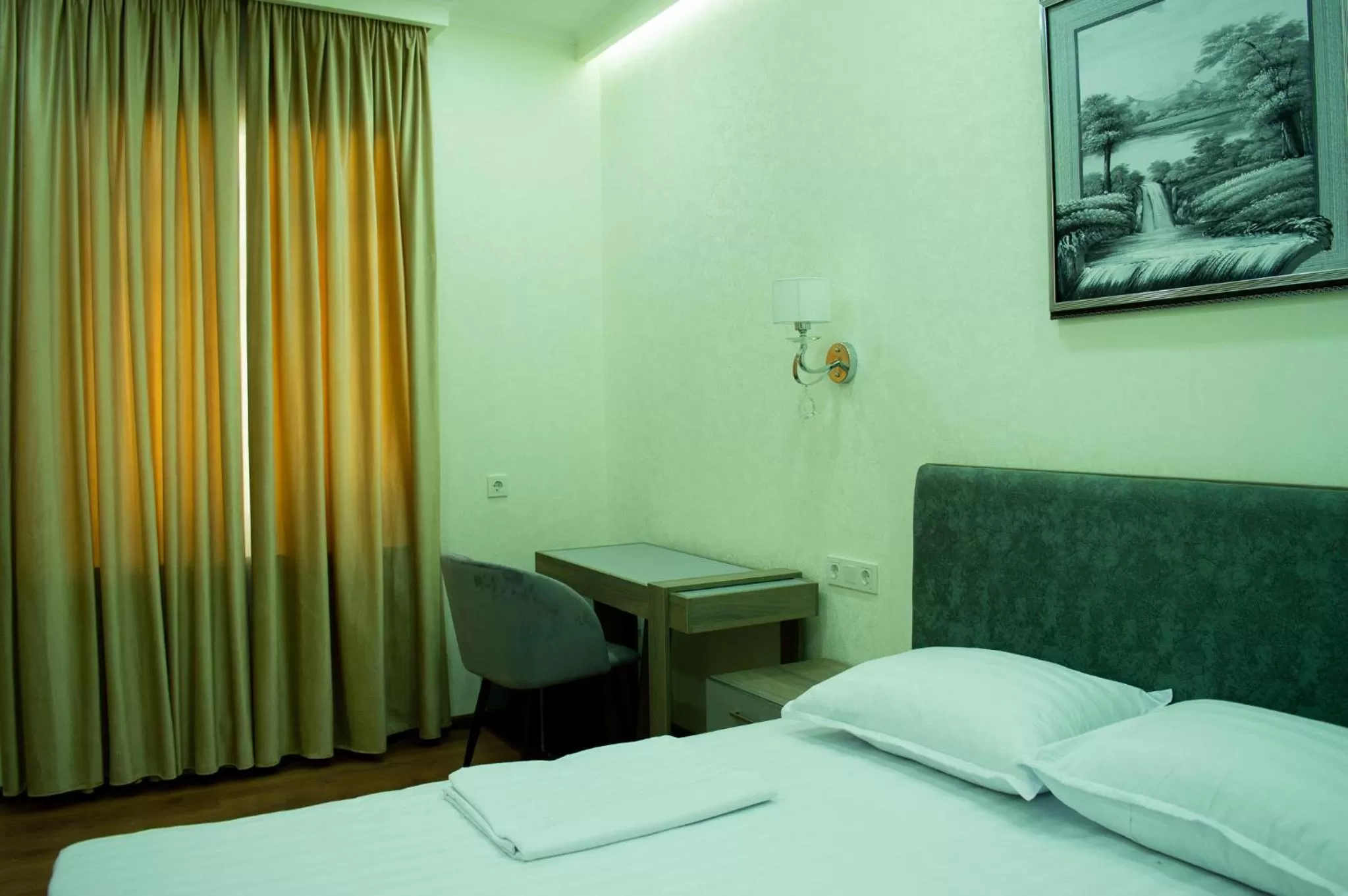 Bed in Registon Saroy Hotel