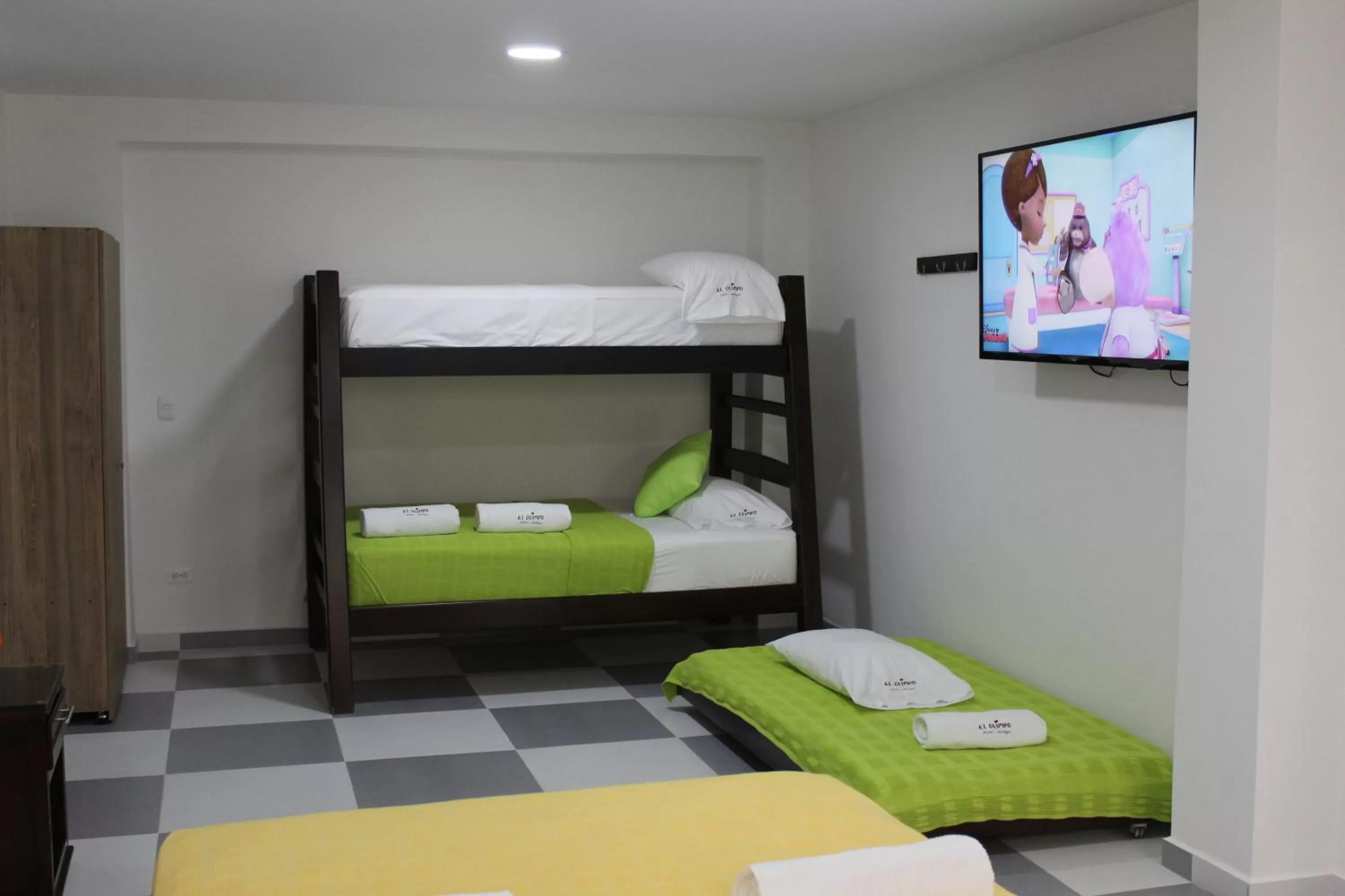 Communal lounge/ TV room, Bed in Hotel El Olimpo