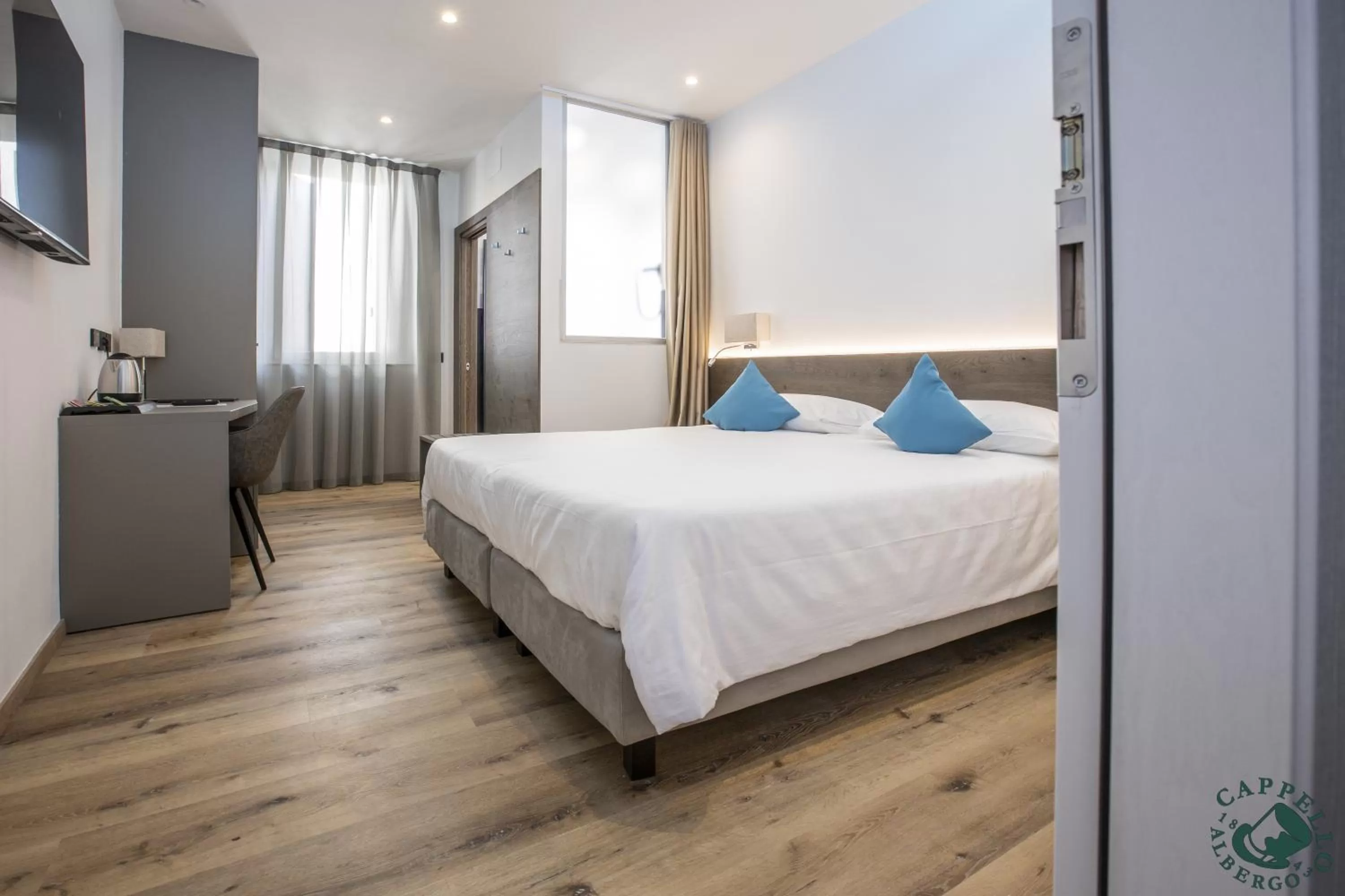 Bed in Albergo Cappello e Cadore