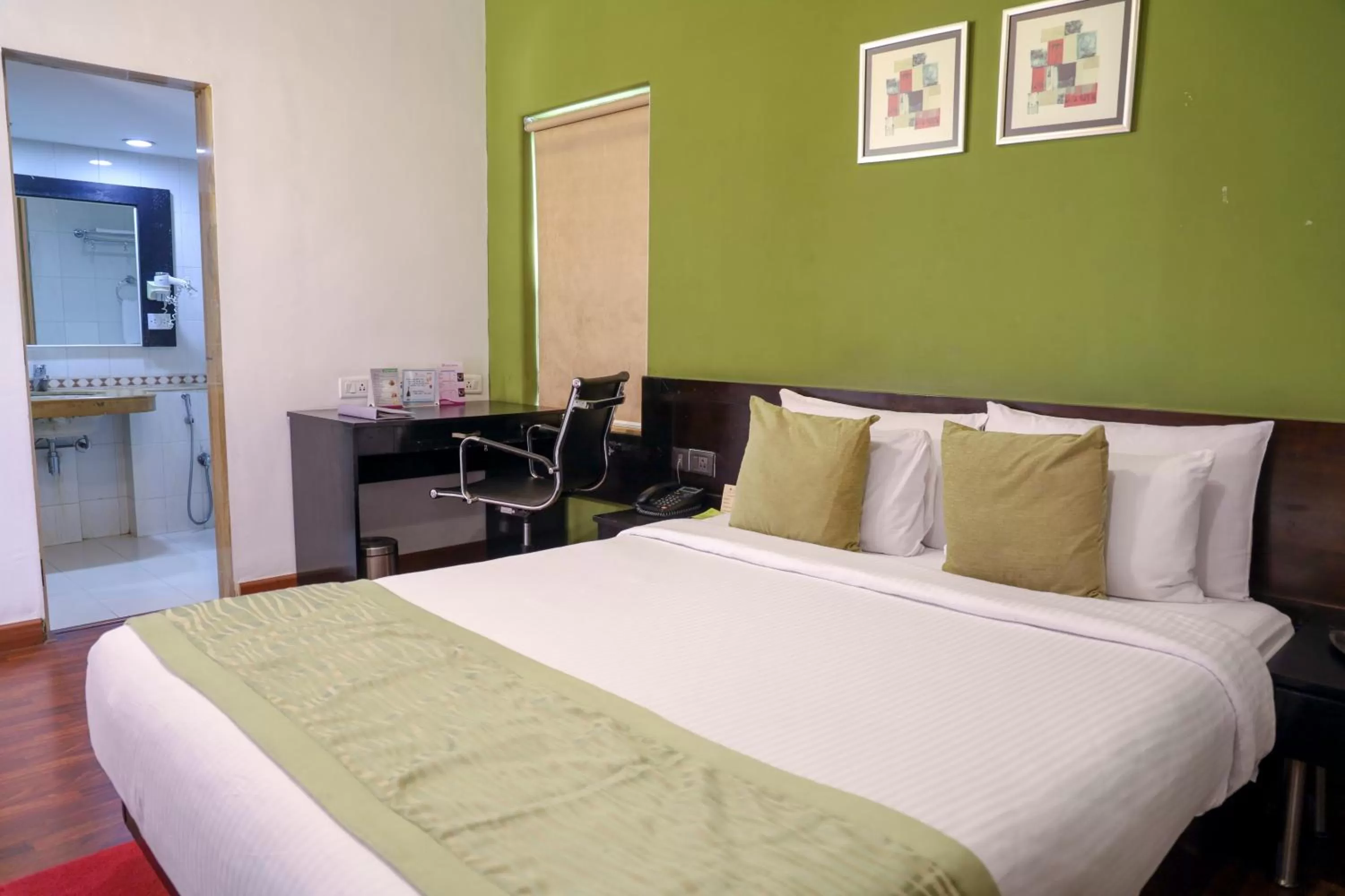 Bed in Royal Orchid Golden Suites Pune