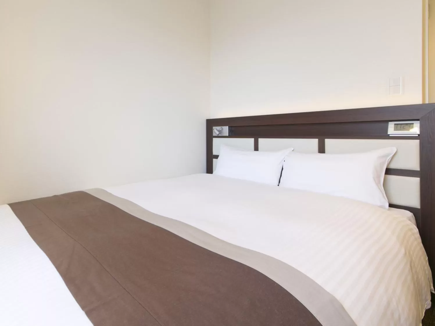 Bed in Urban Hotel Minami Kusatsu