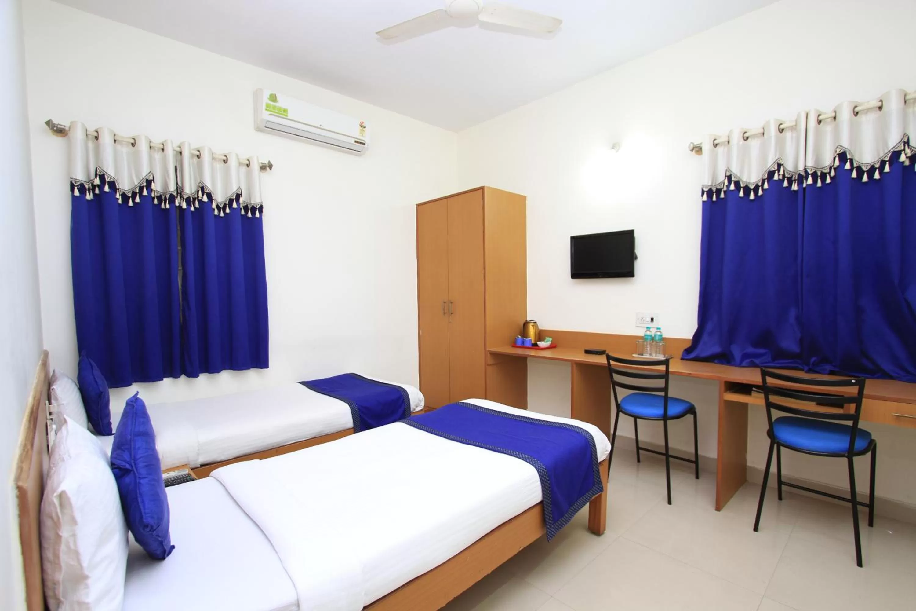 Bed in Arra Suites kempegowda Airport Hotel