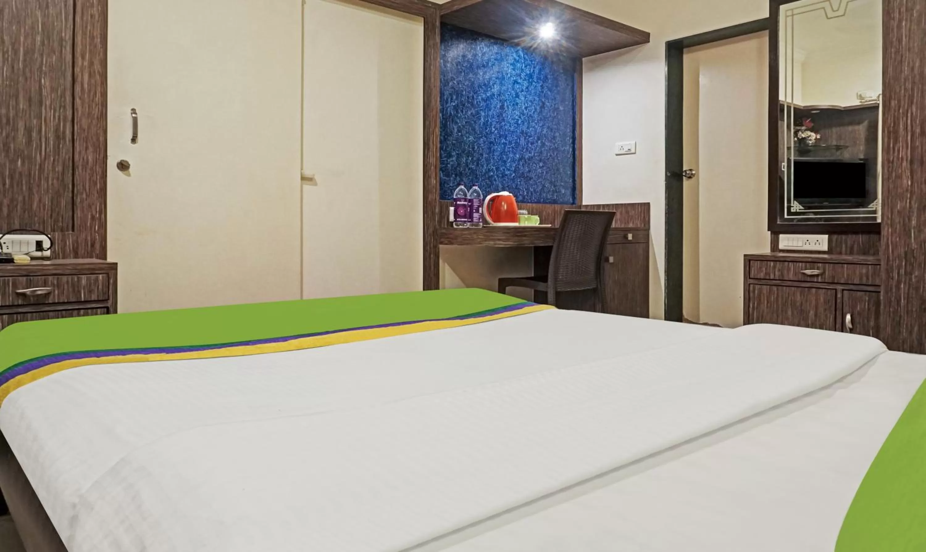 Bedroom, Bed in Treebo Excellent Home