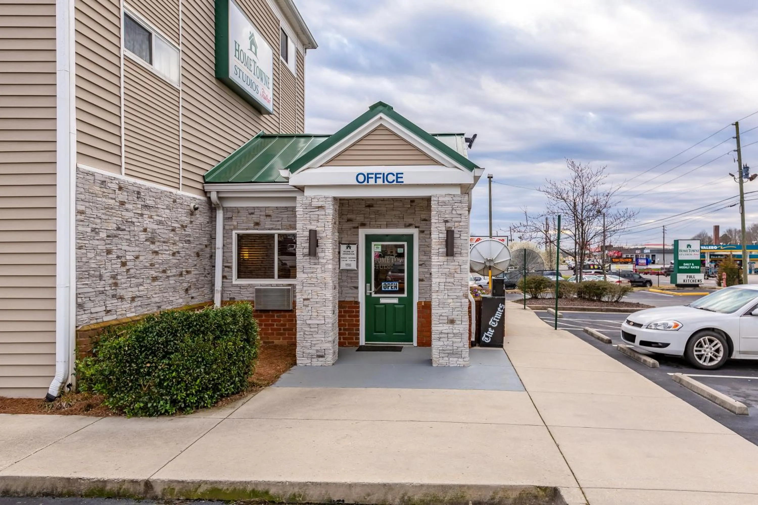 Property building in HomeTowne Studios by Red Roof Gainesville, GA