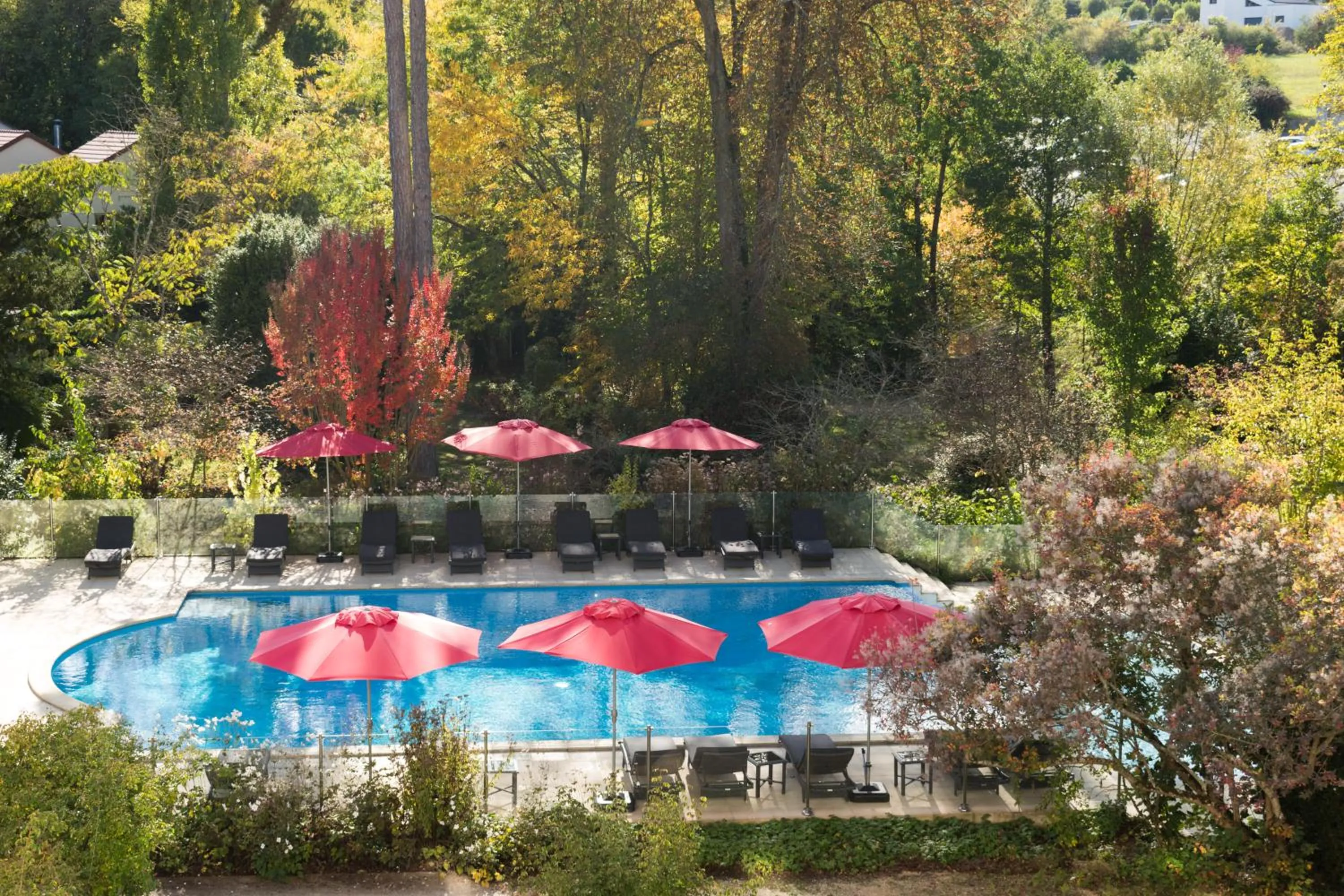 Swimming pool in Logis Les Loges du Parc