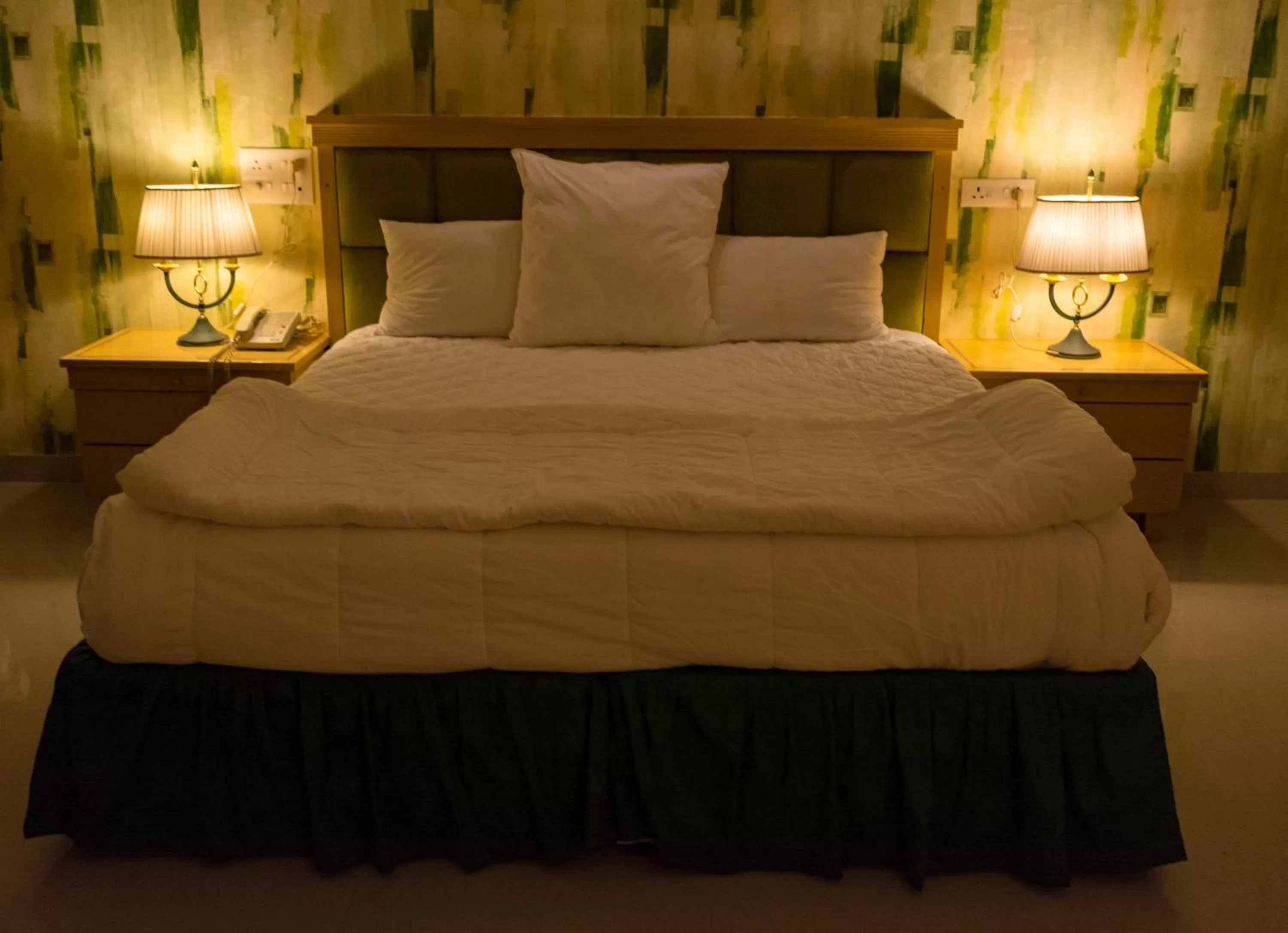 Bed in Mango Valley Resort Ganpatipule