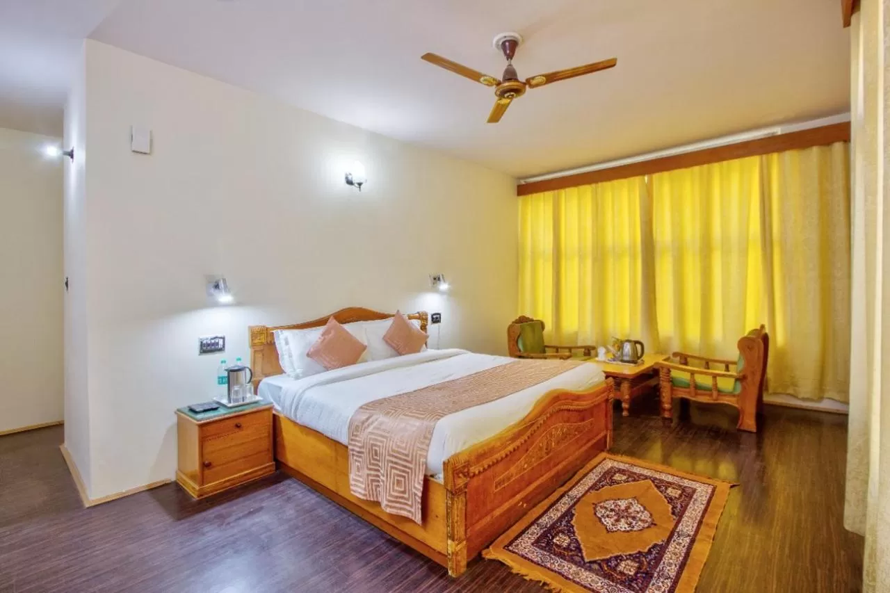 Bed in Ayushman Hotels