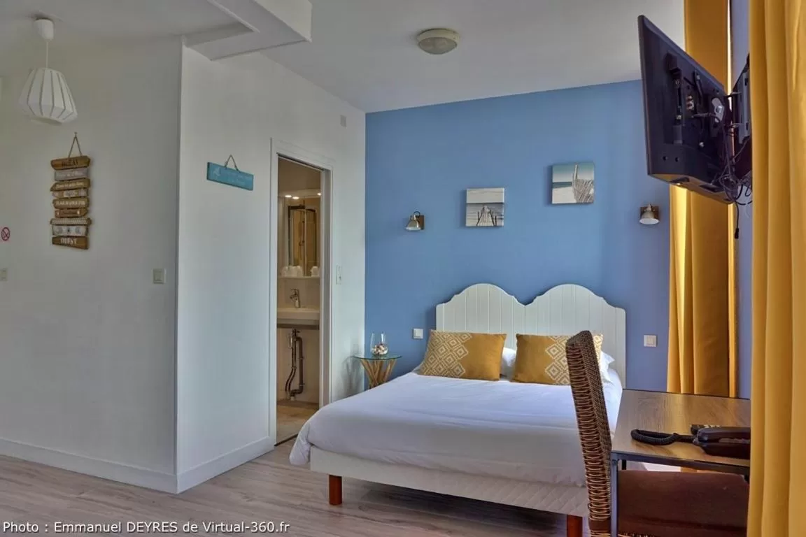 Quadruple Room with Garden View in Hôtel de Bretagne - anciennement Queen Serenity Hotel