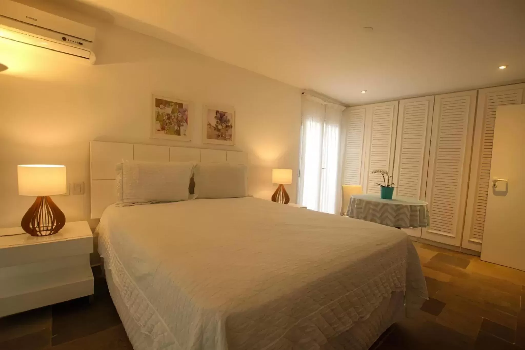 Bed in Guest House Guarujá