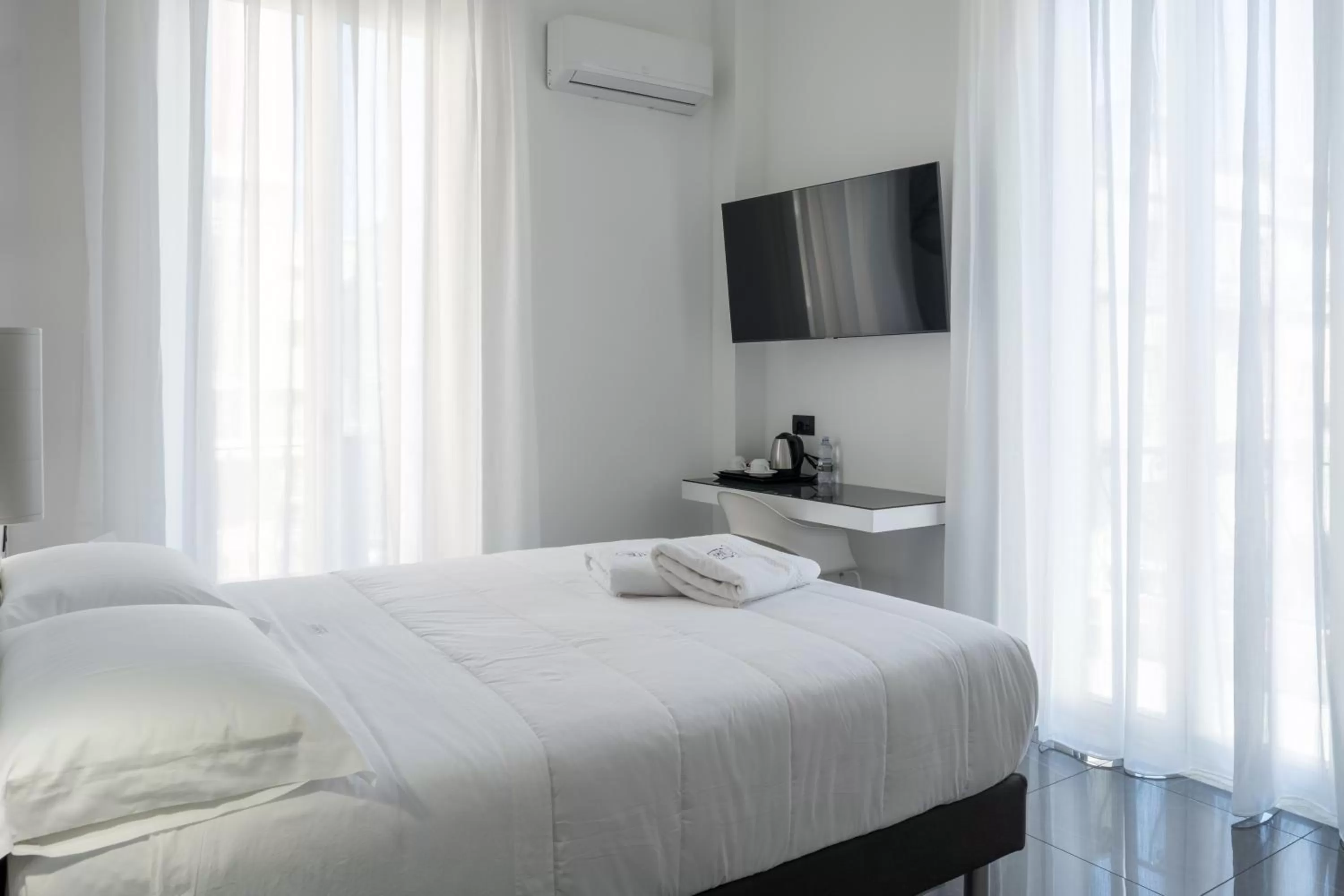 Bed in Domea Superior Rooms Bed and Breakfast