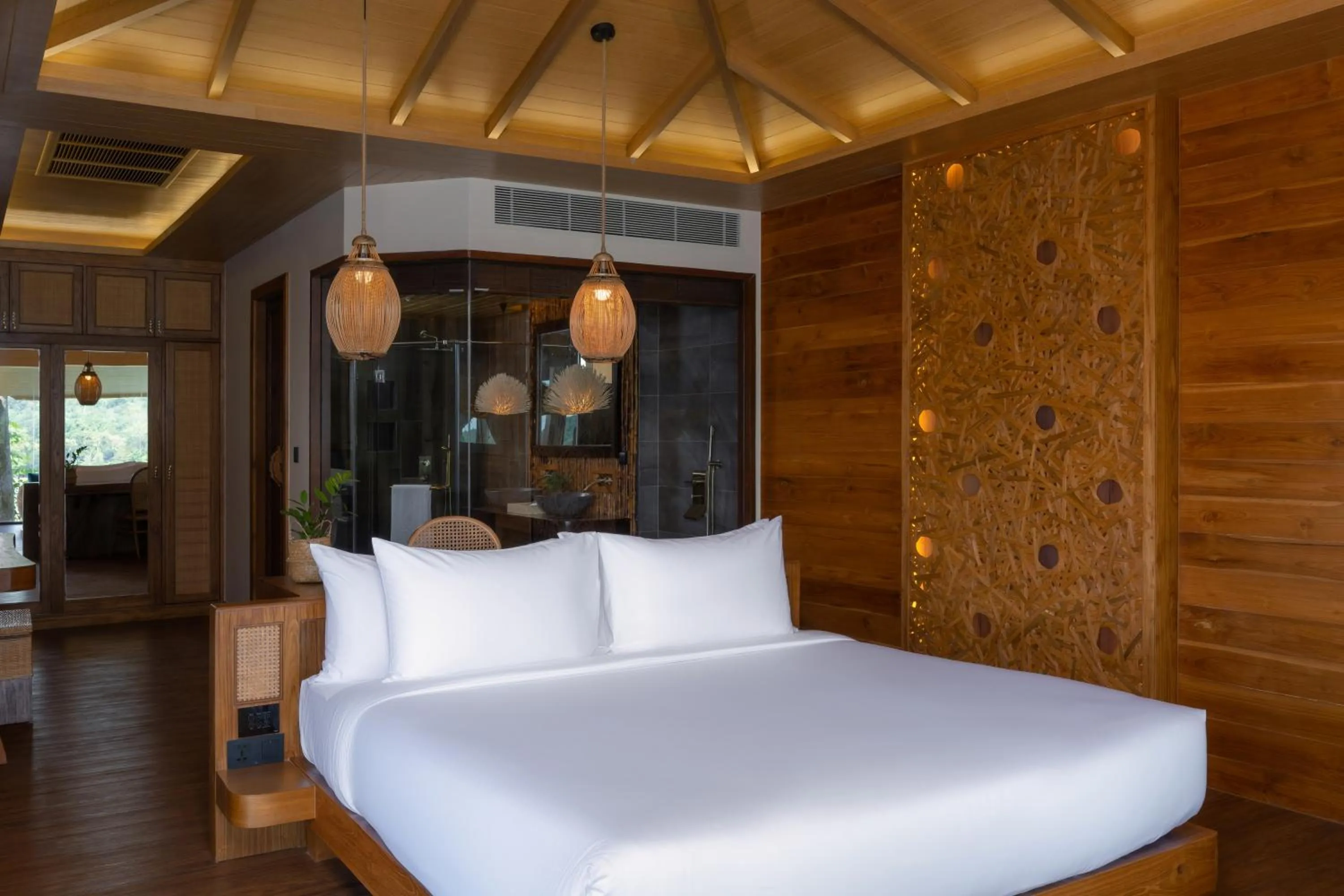 Bed in SINAE Phuket Luxury Hotel