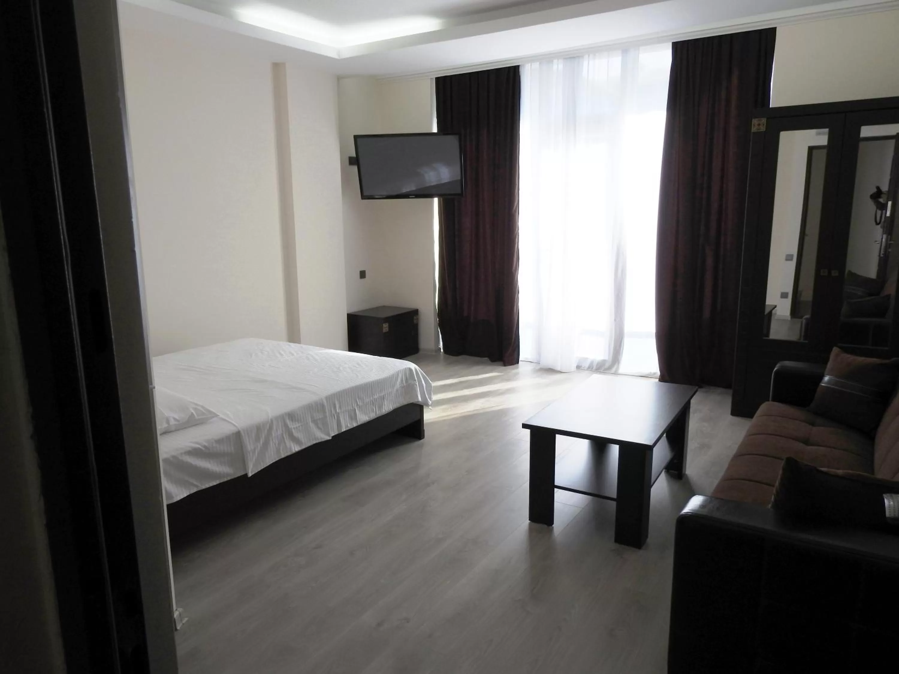 Bed in Iko's Family Apartments