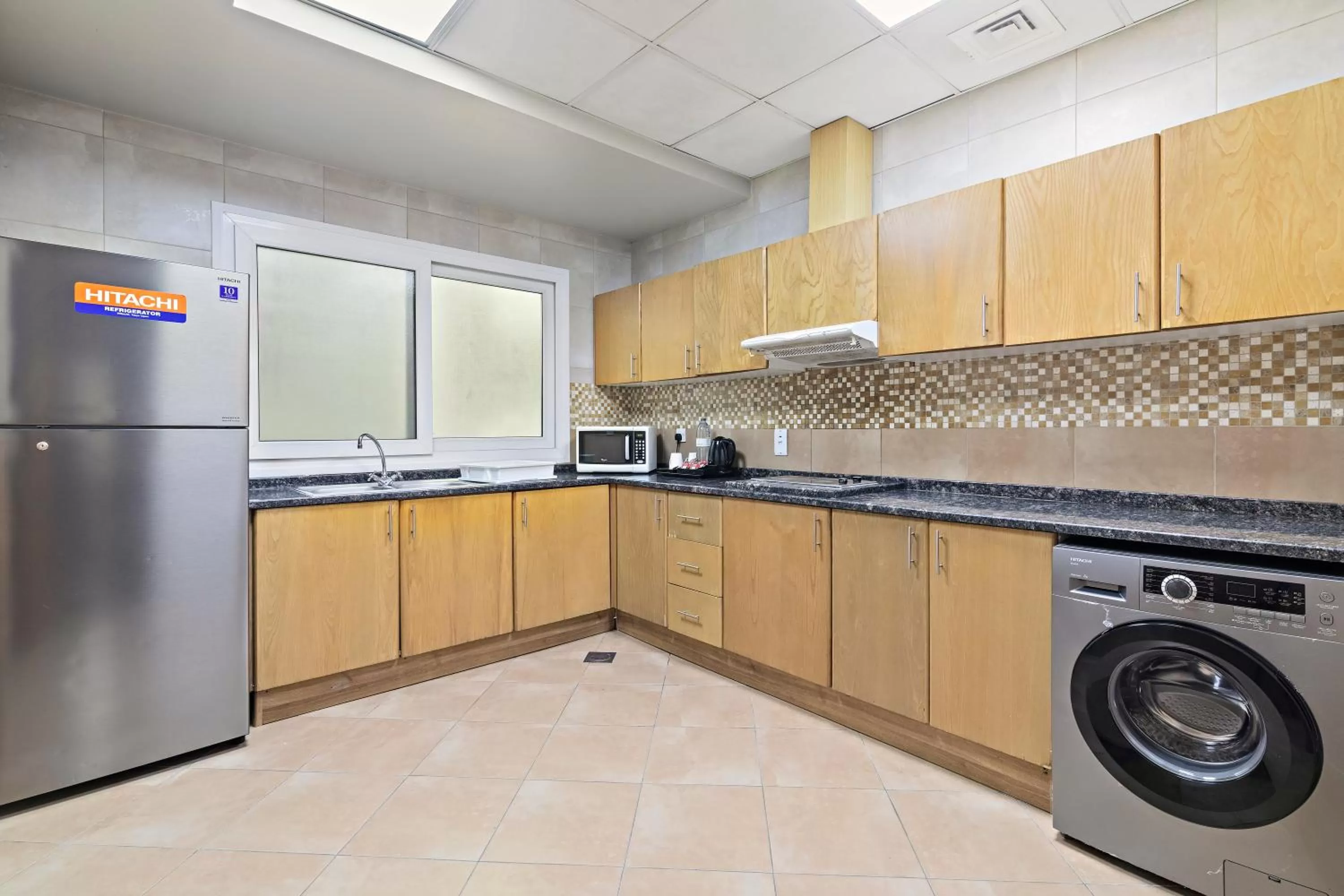 Kitchen or kitchenette in Al Khoory Hotel Apartments Al Barsha