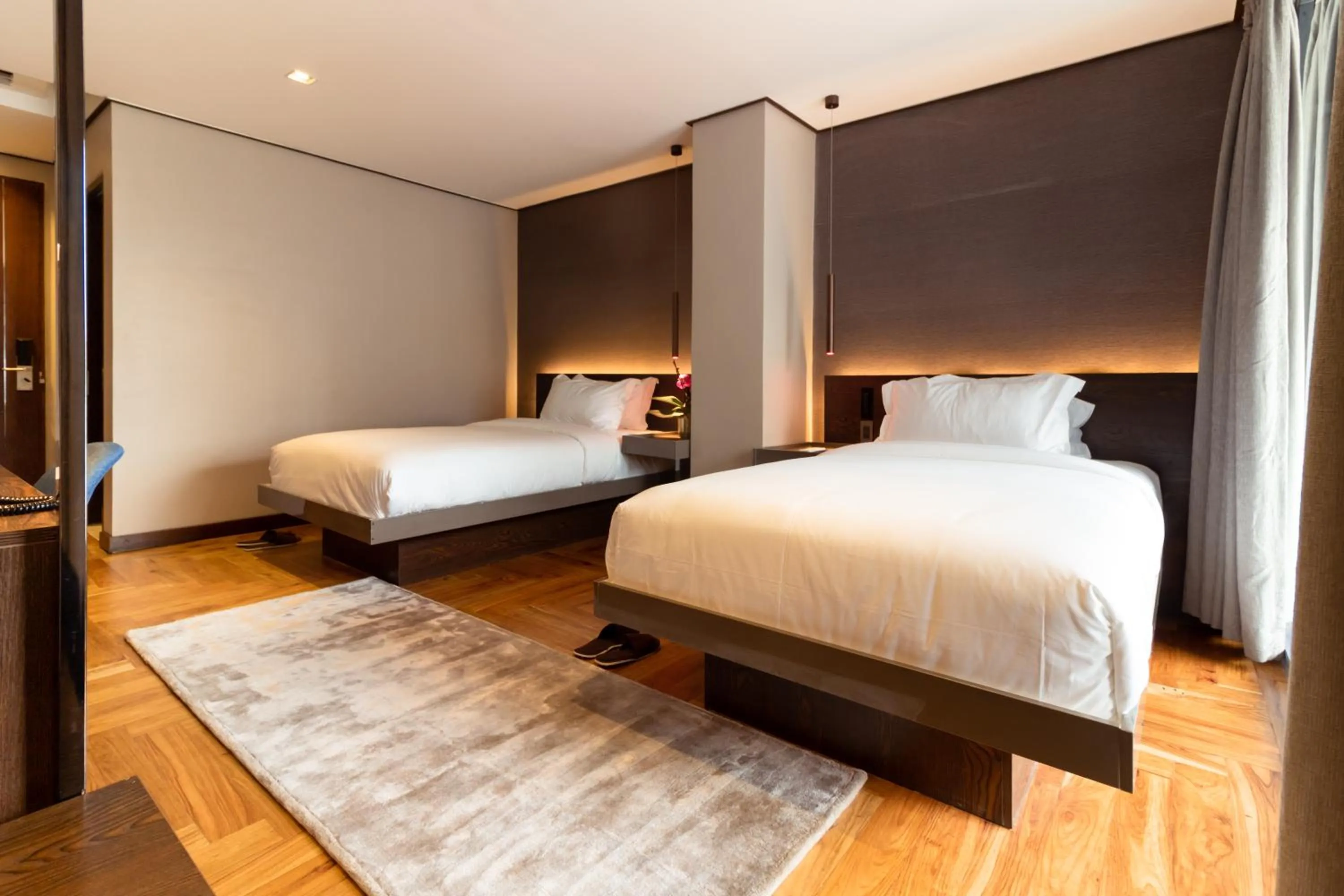 Bed in Ramada Encore by Wyndham Makati