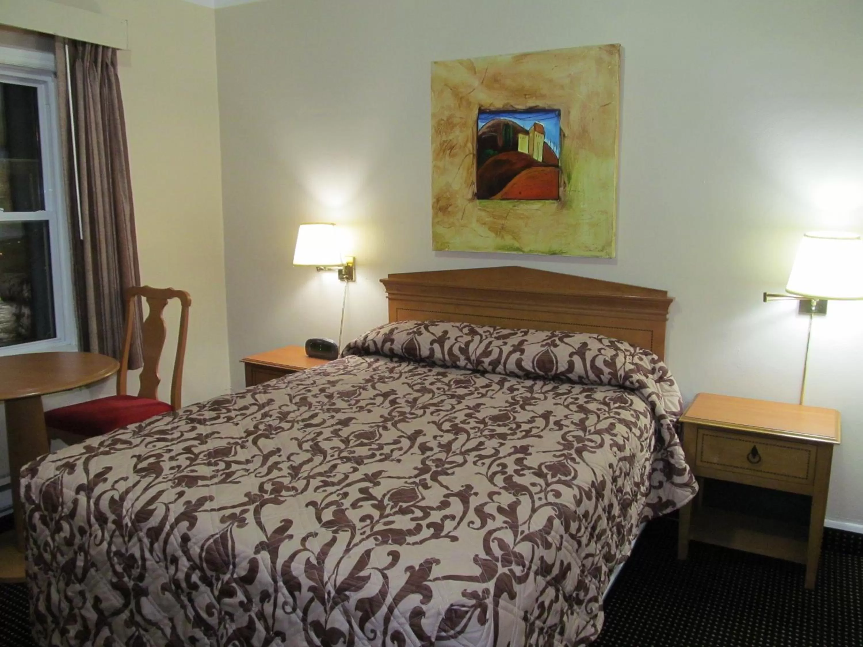 Bed in Knights Inn London Ontario