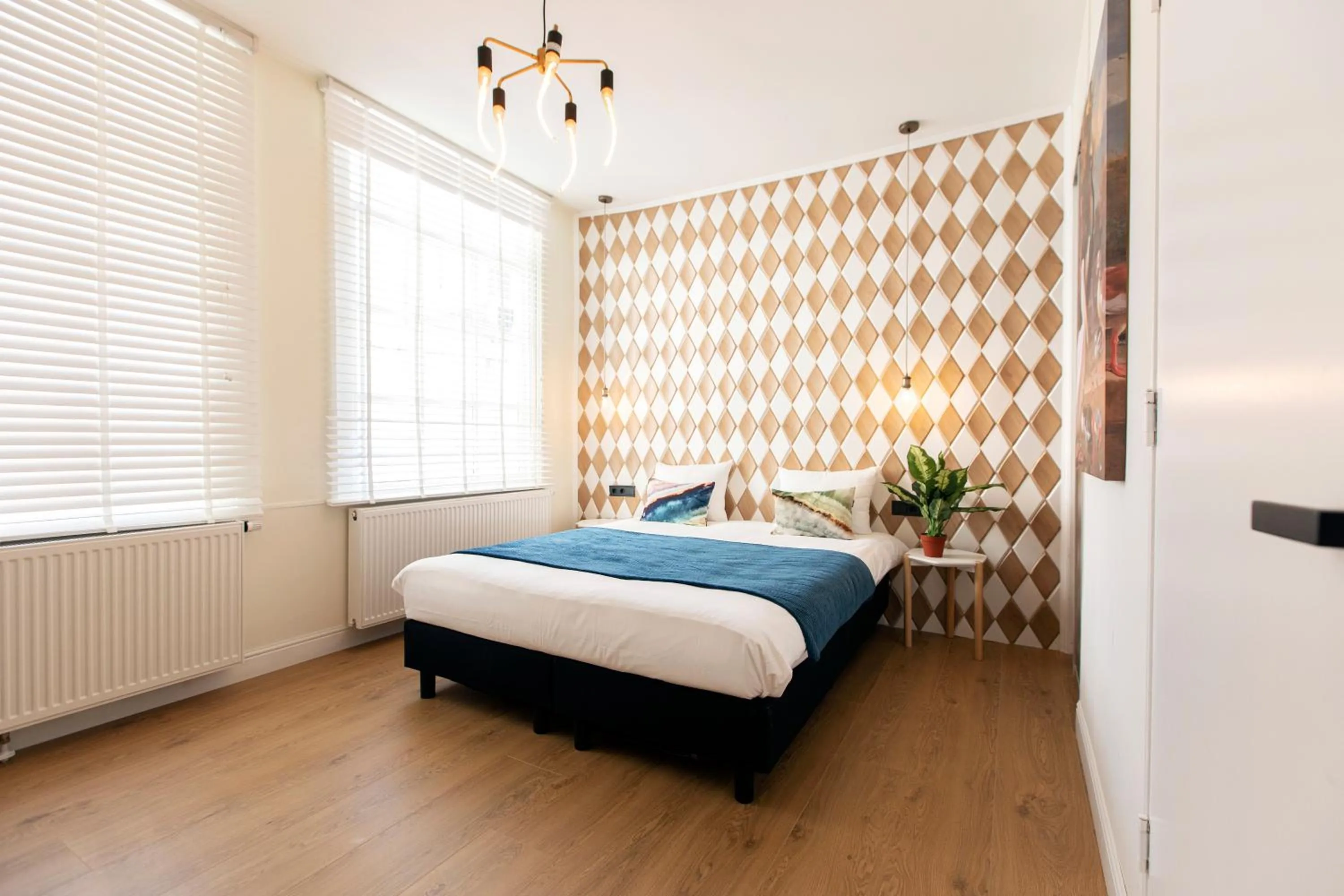 Bed in Quentin Golden Bear Hotel