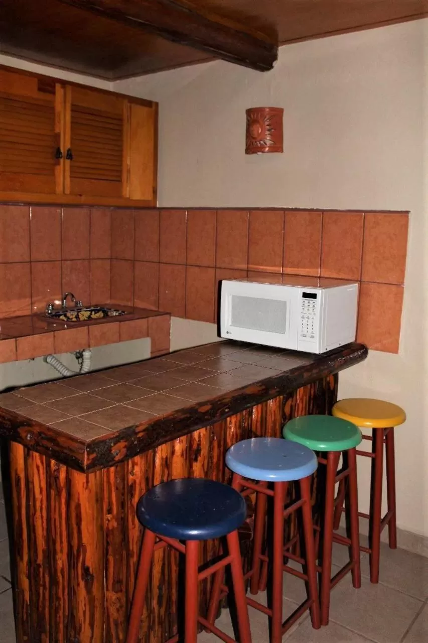 Kitchen or kitchenette in Cabañas Rústicas El Benny by Rotamundos