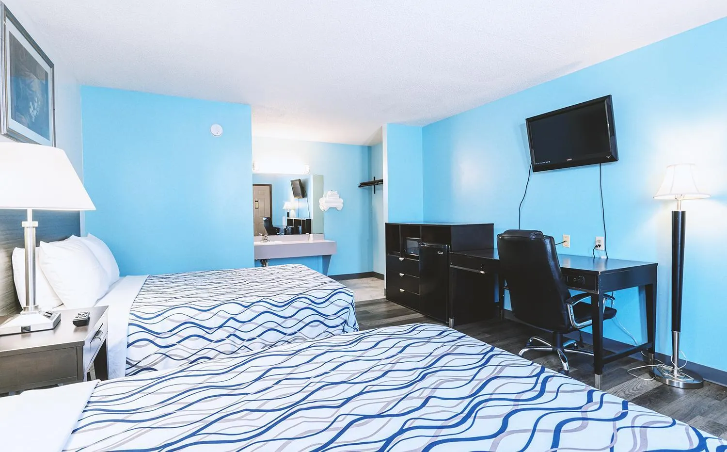 Bed in Blue Way Inn & Suites Wellington