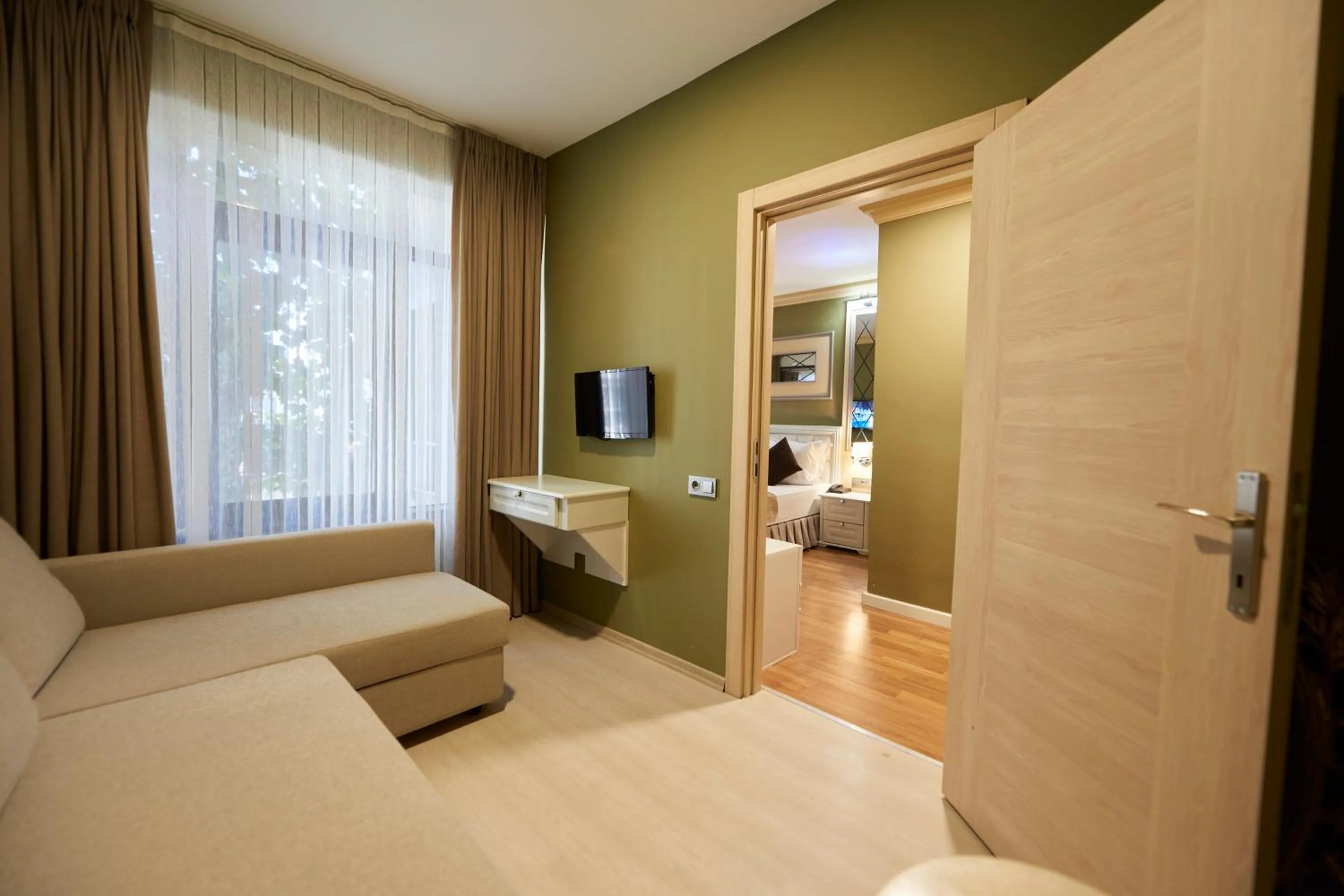 Living room, Bed in Sunlight Hotel