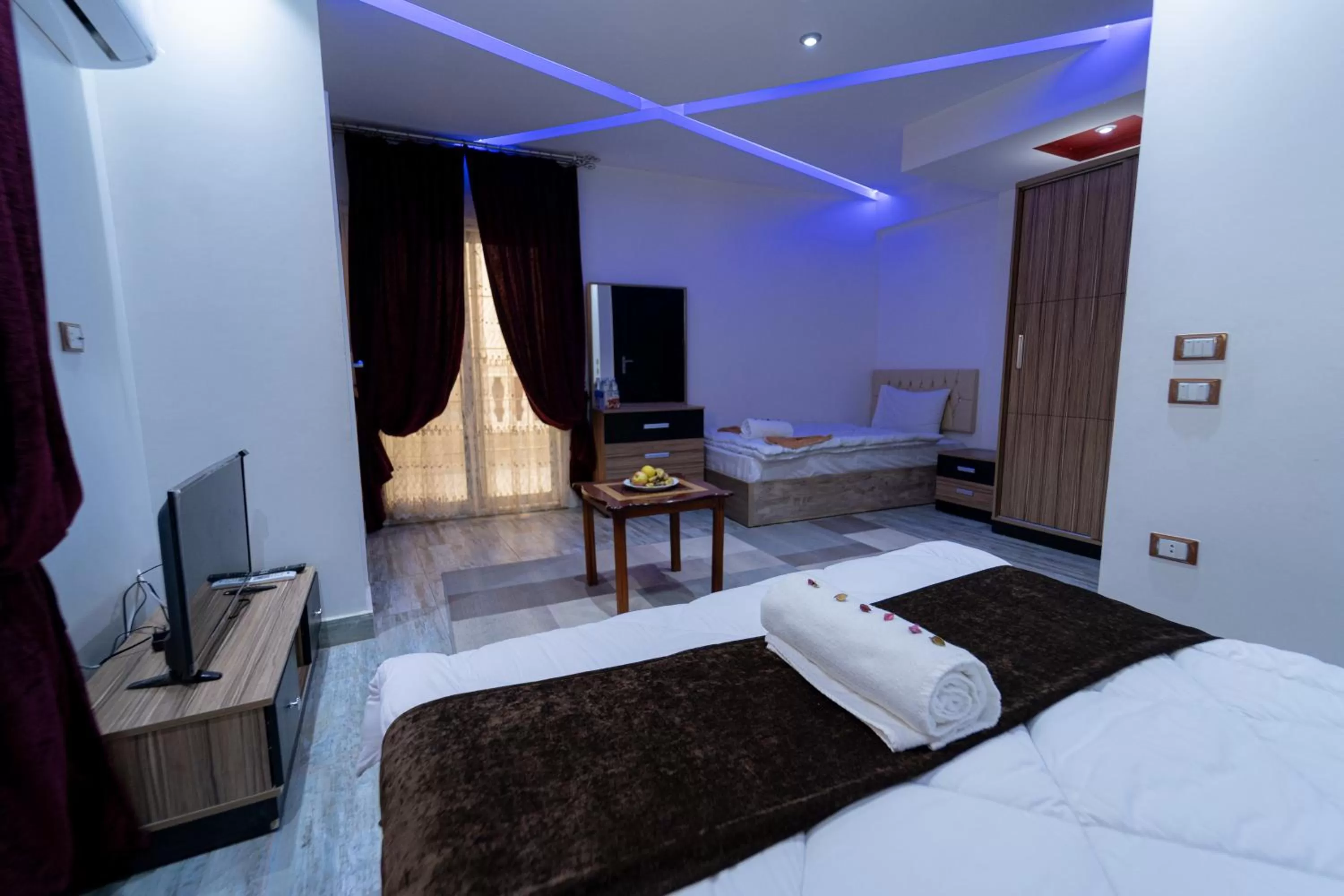 Photo of the whole room, Bed in Gardenia Inn Hotel