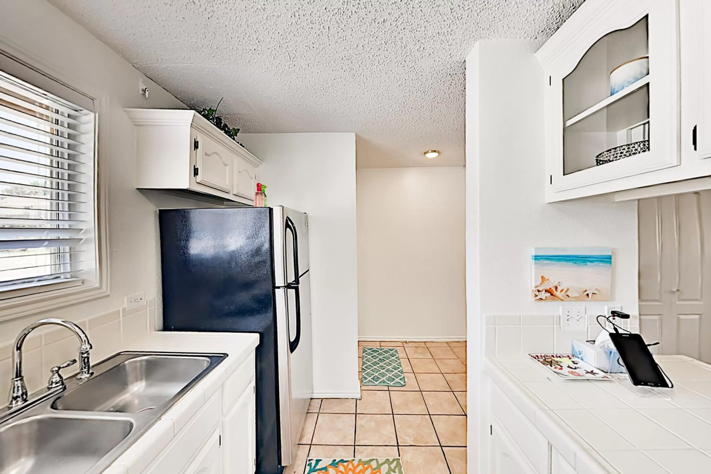 Kitchen/Kitchenette in Dolphin Condominiums #12