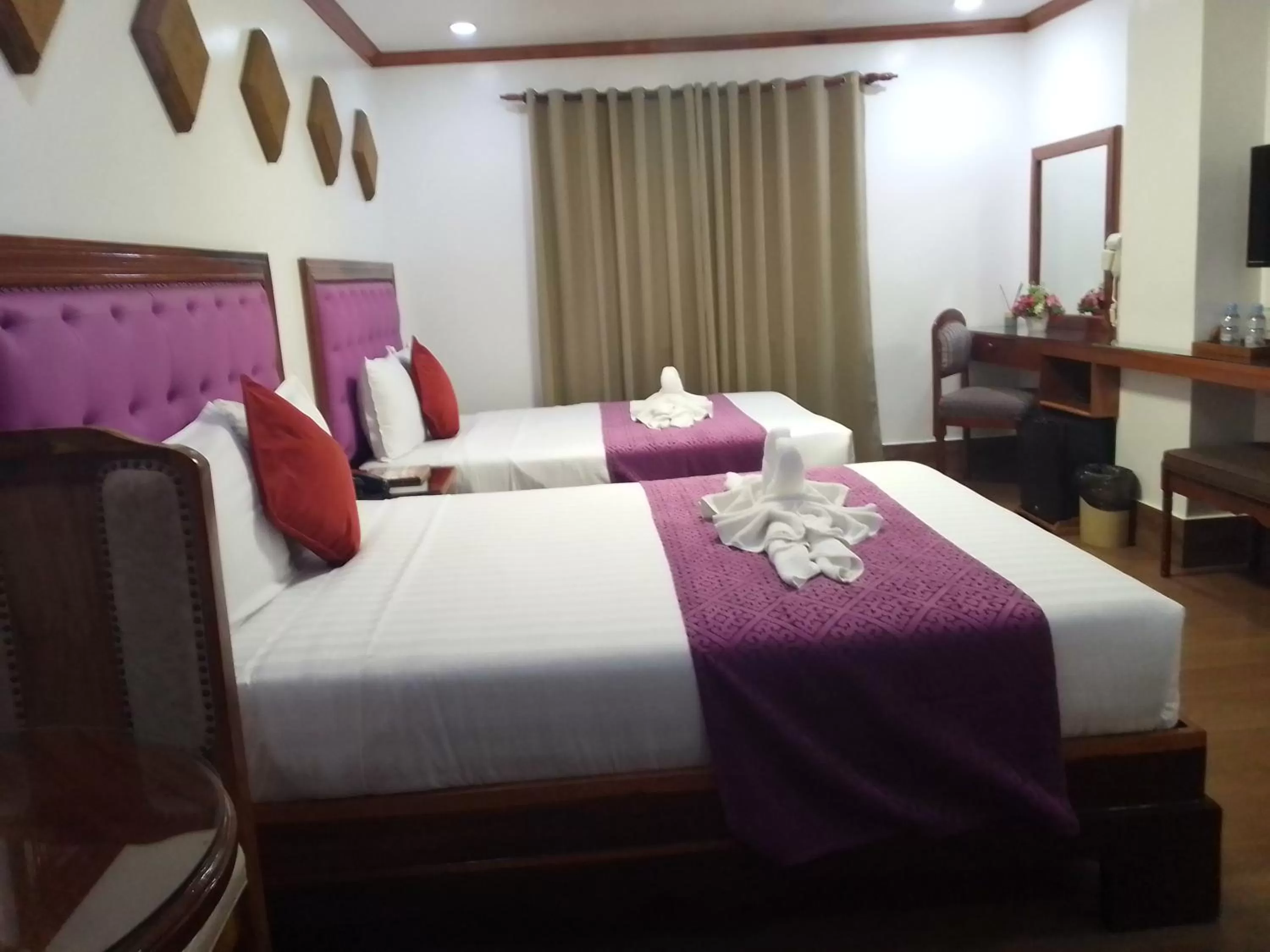 Bed in CLN Boutique Hotel
