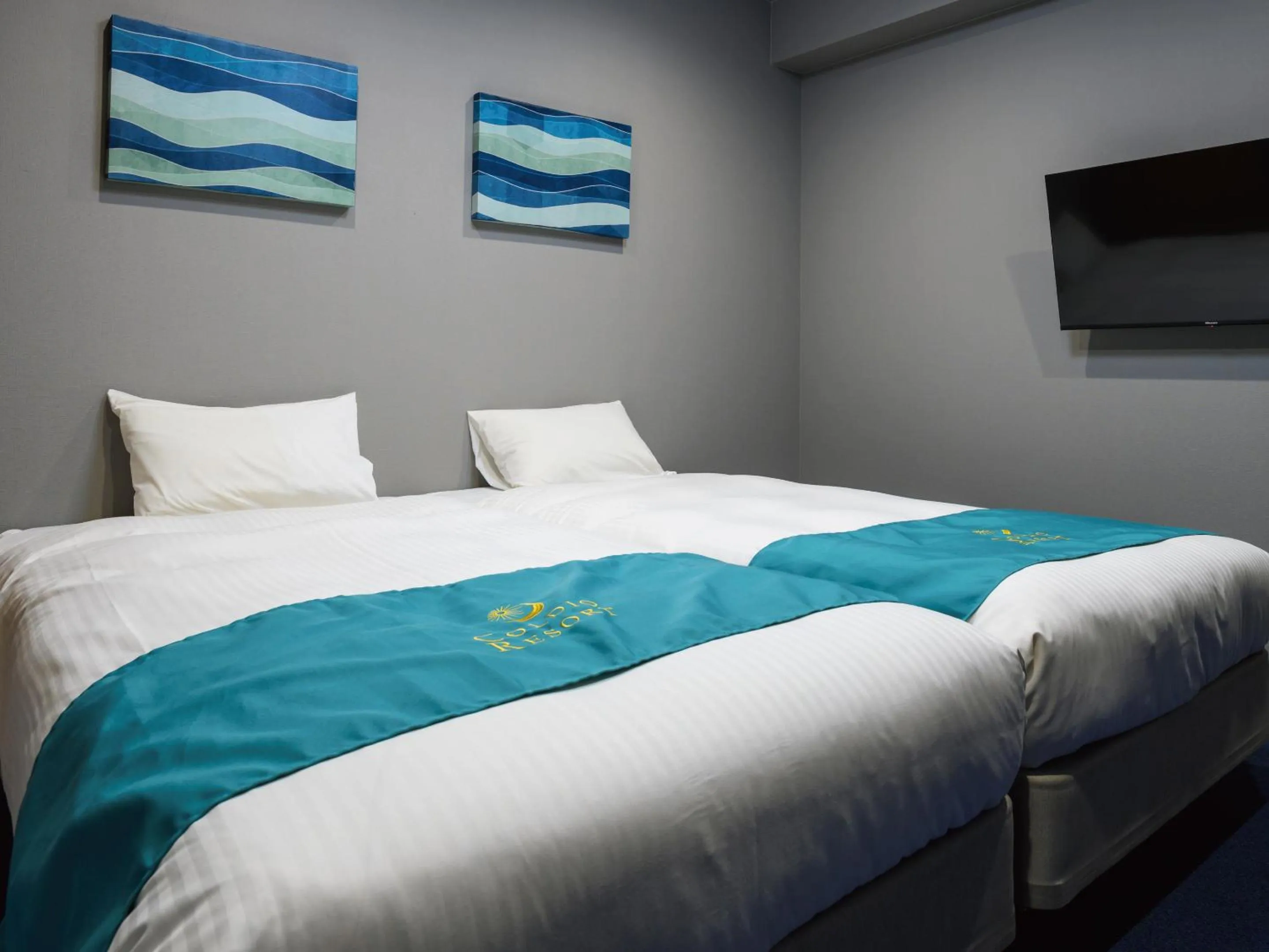 Bed in Condominium L's INN