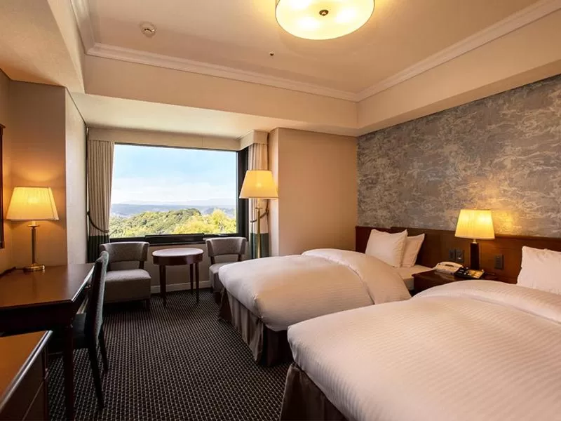 Bed in SHIROYAMA HOTEL kagoshima