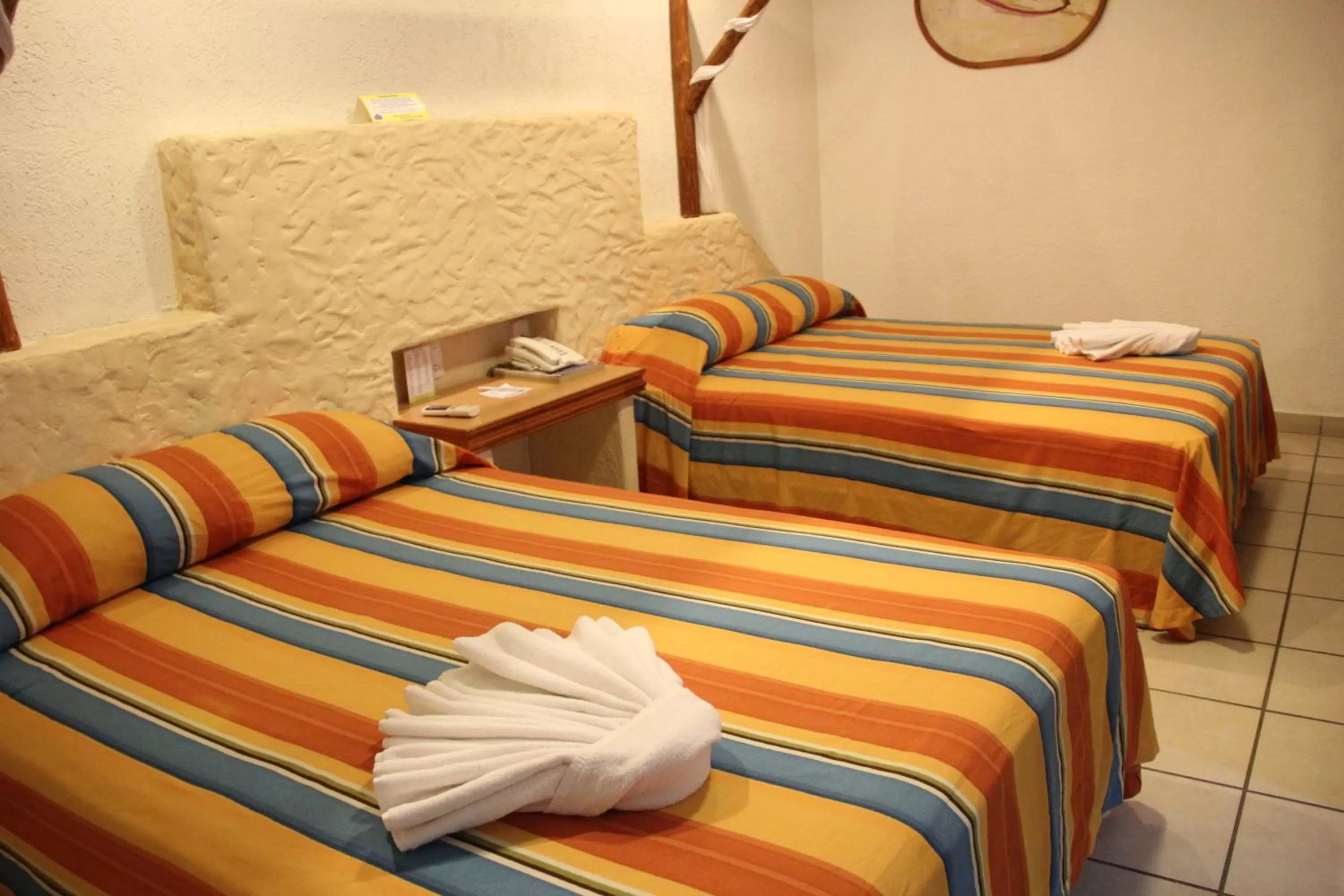 Bed in Hotel Palapa Palace