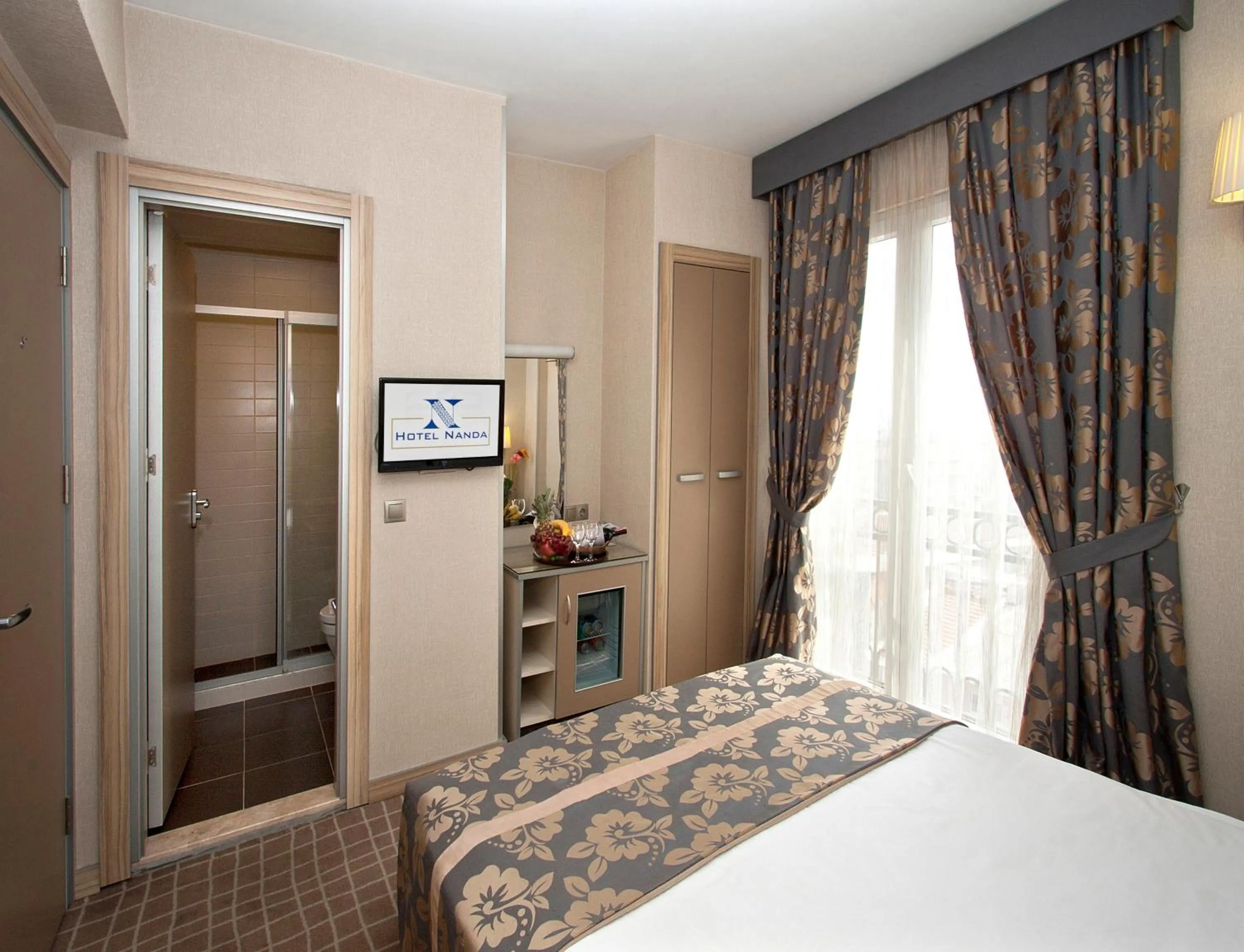 Photo of the whole room, Bed in Nanda Hotel