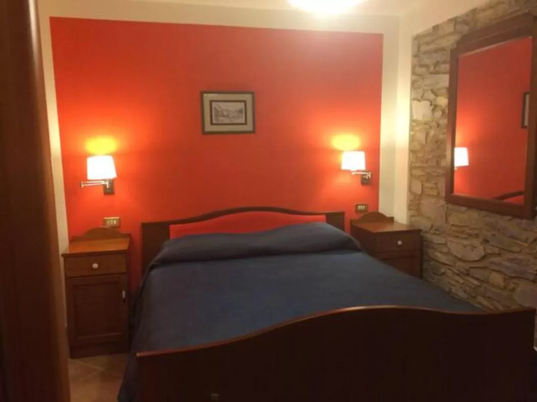 Bed in Albergo Miramonti