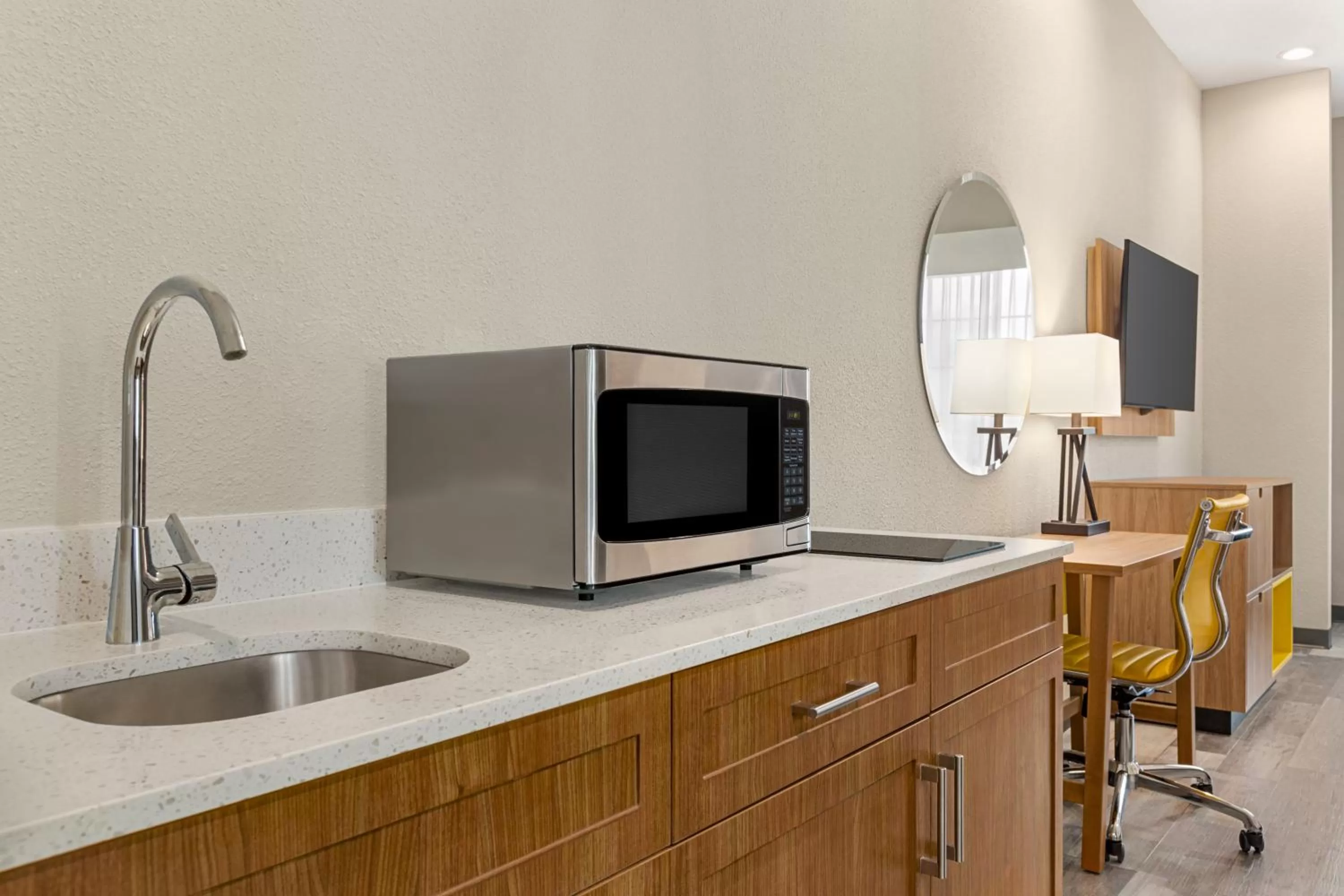 Kitchen or kitchenette in Days Inn & Suites by Wyndham Greater Tomball