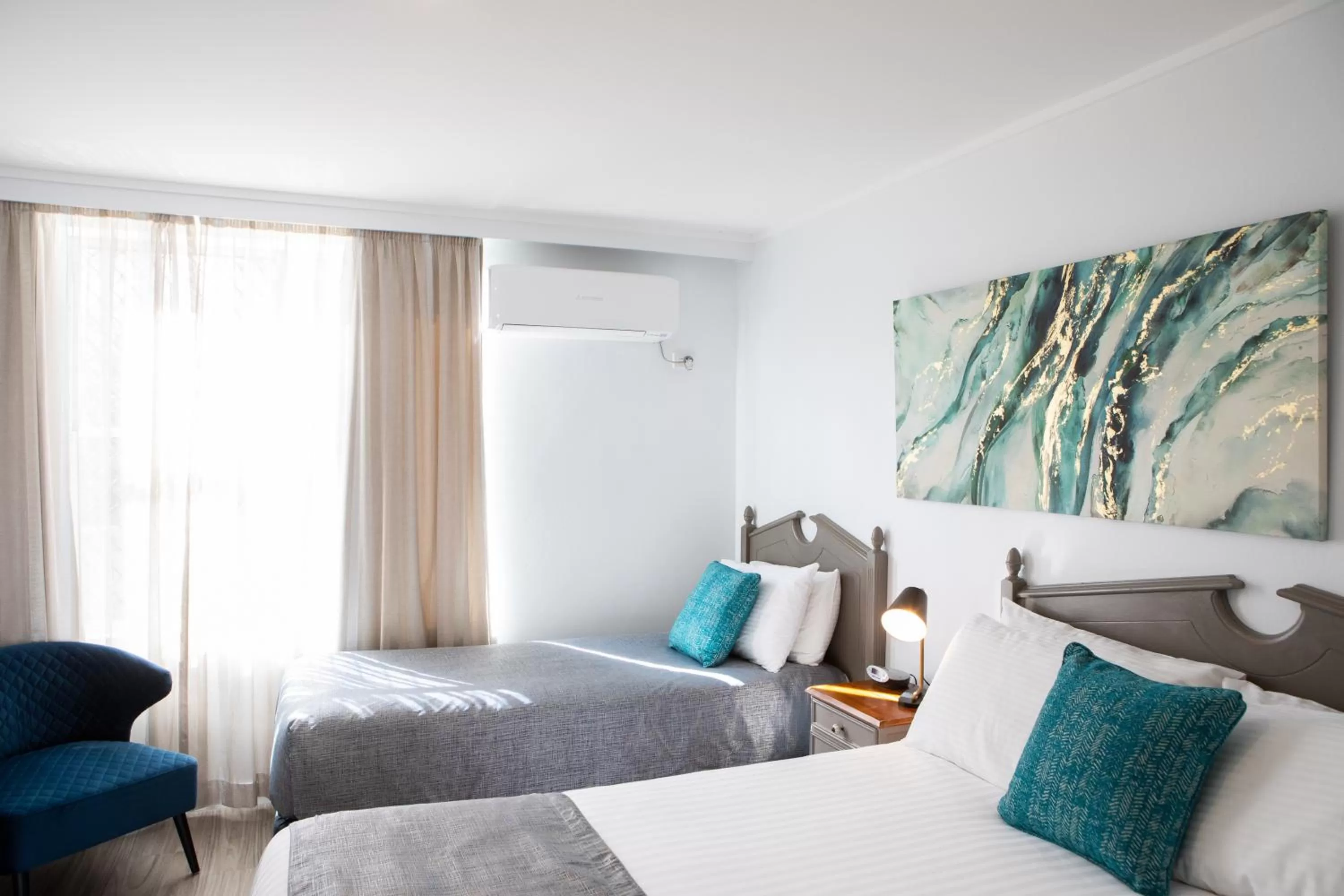 Bed in New England Motor Lodge