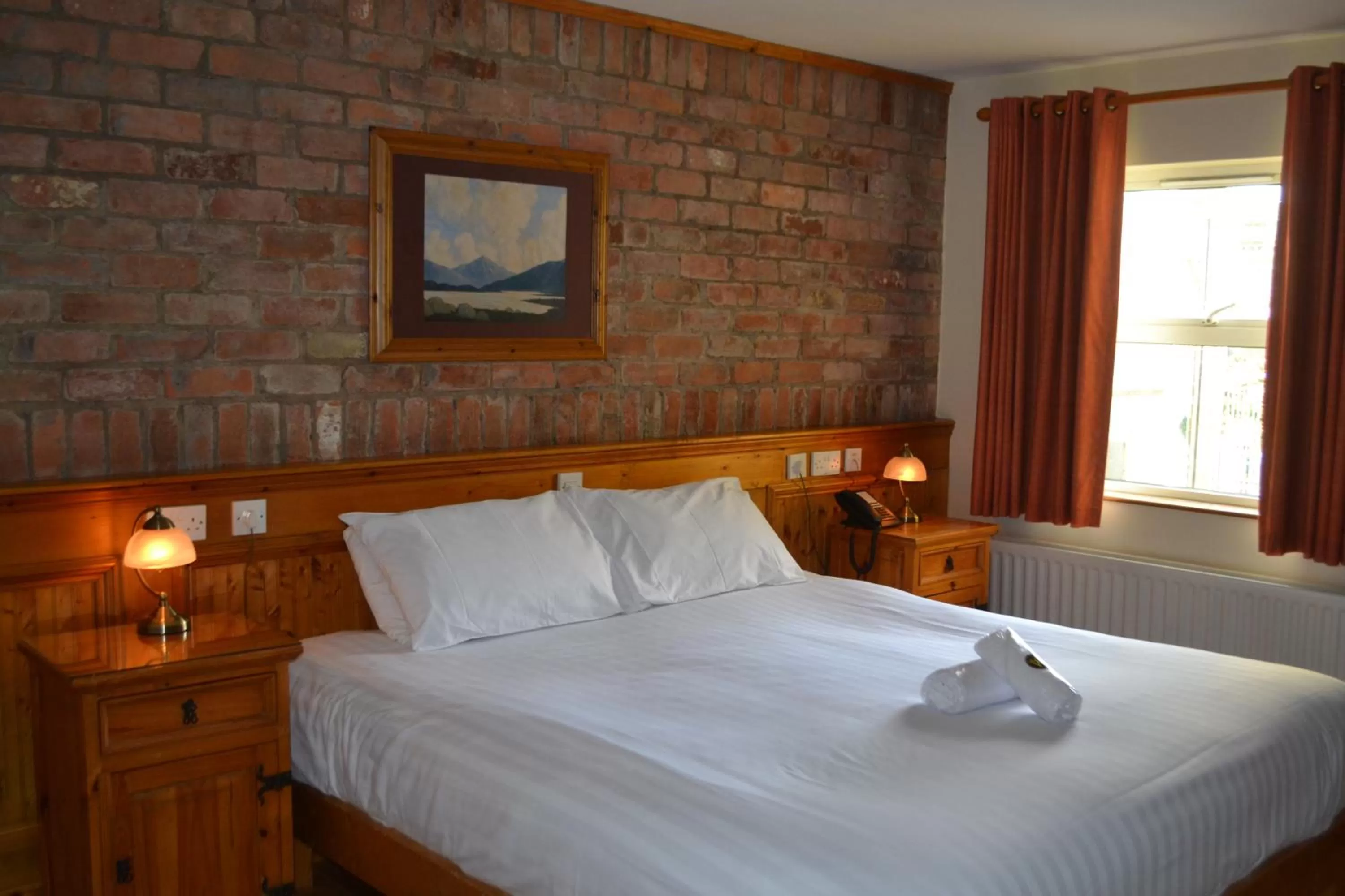 Bed in Walsh's Hotel and Apartments