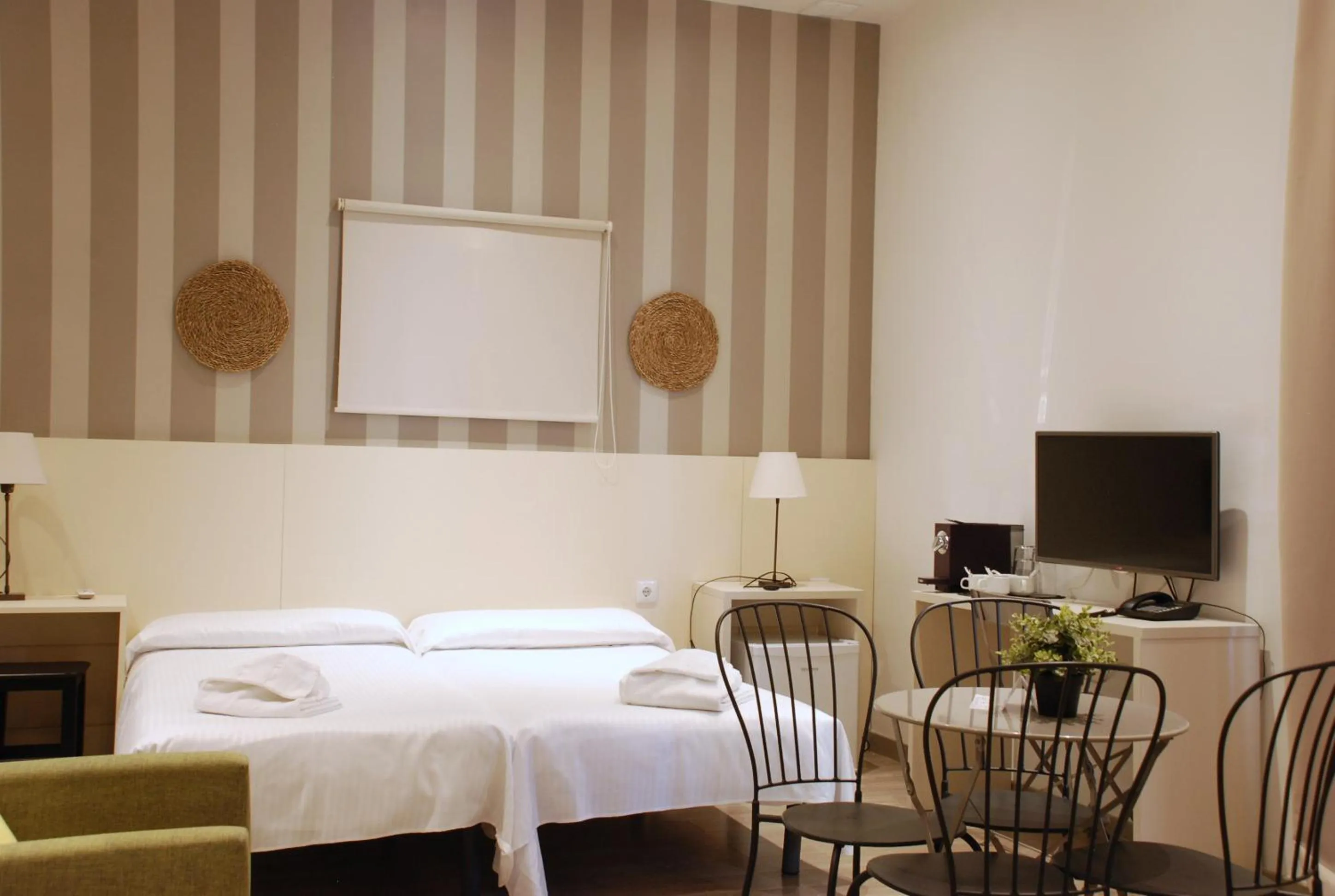 Bed in Hotel San Lorenzo Boutique Plaza