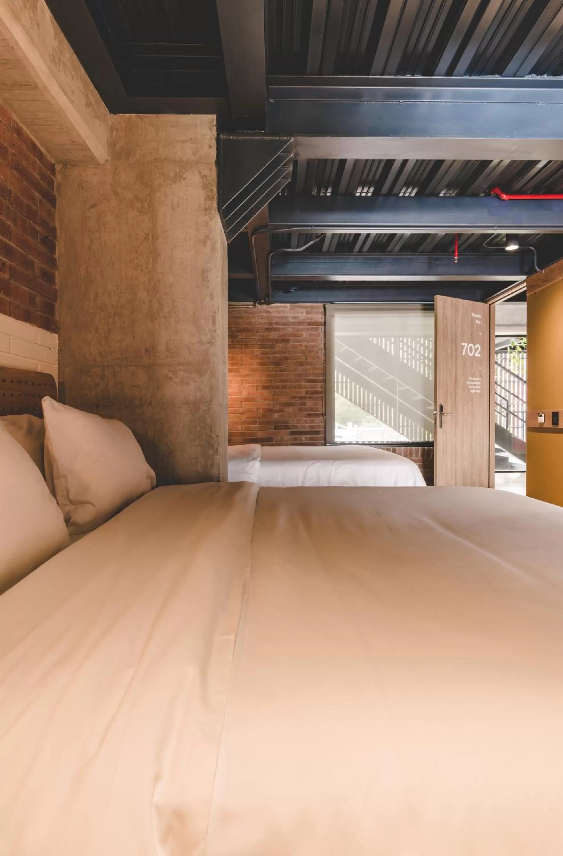 Bed in The Somos Beats Hotel & Rooftop