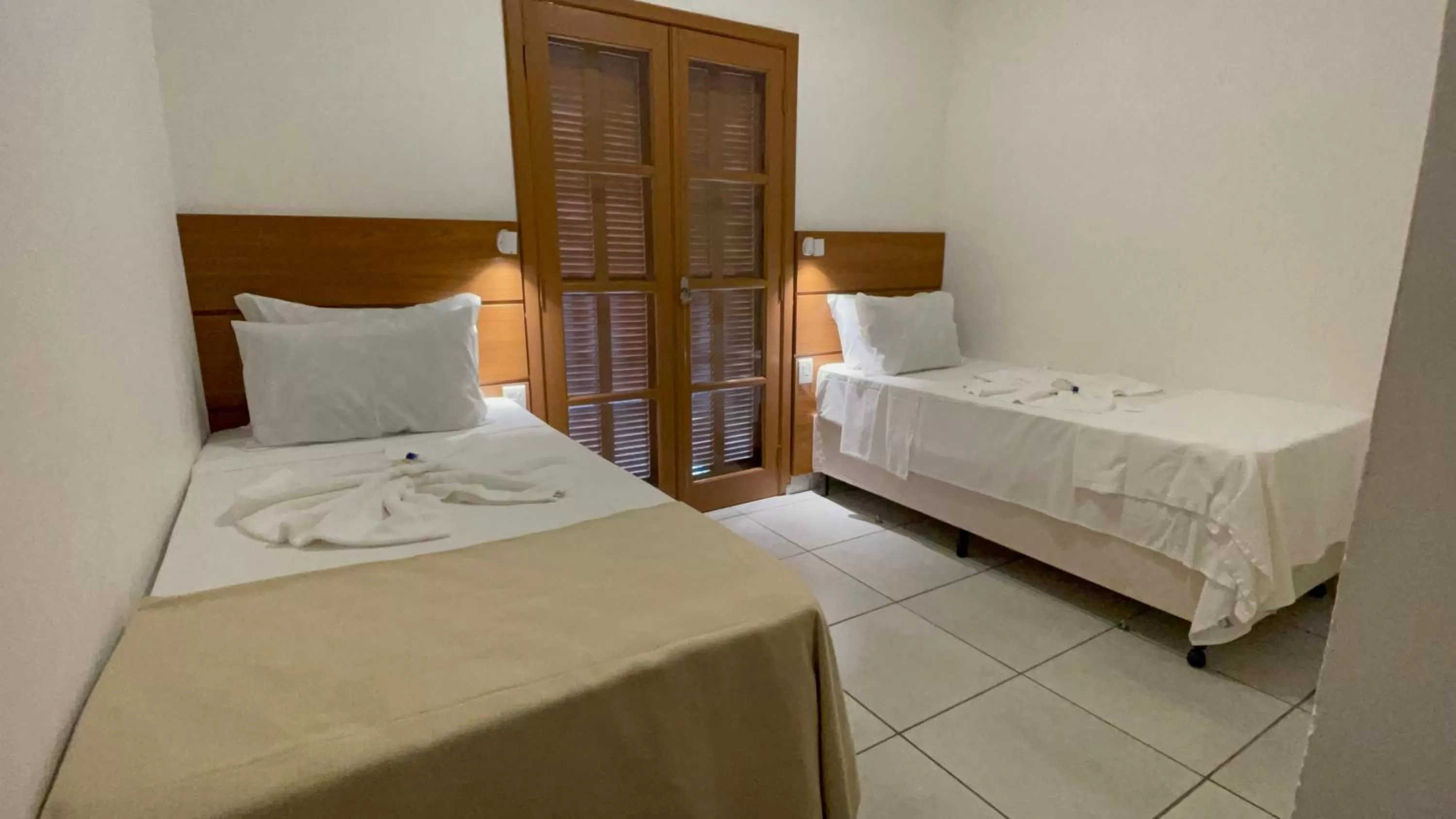 Bed in Pousada Ilha Vitoria