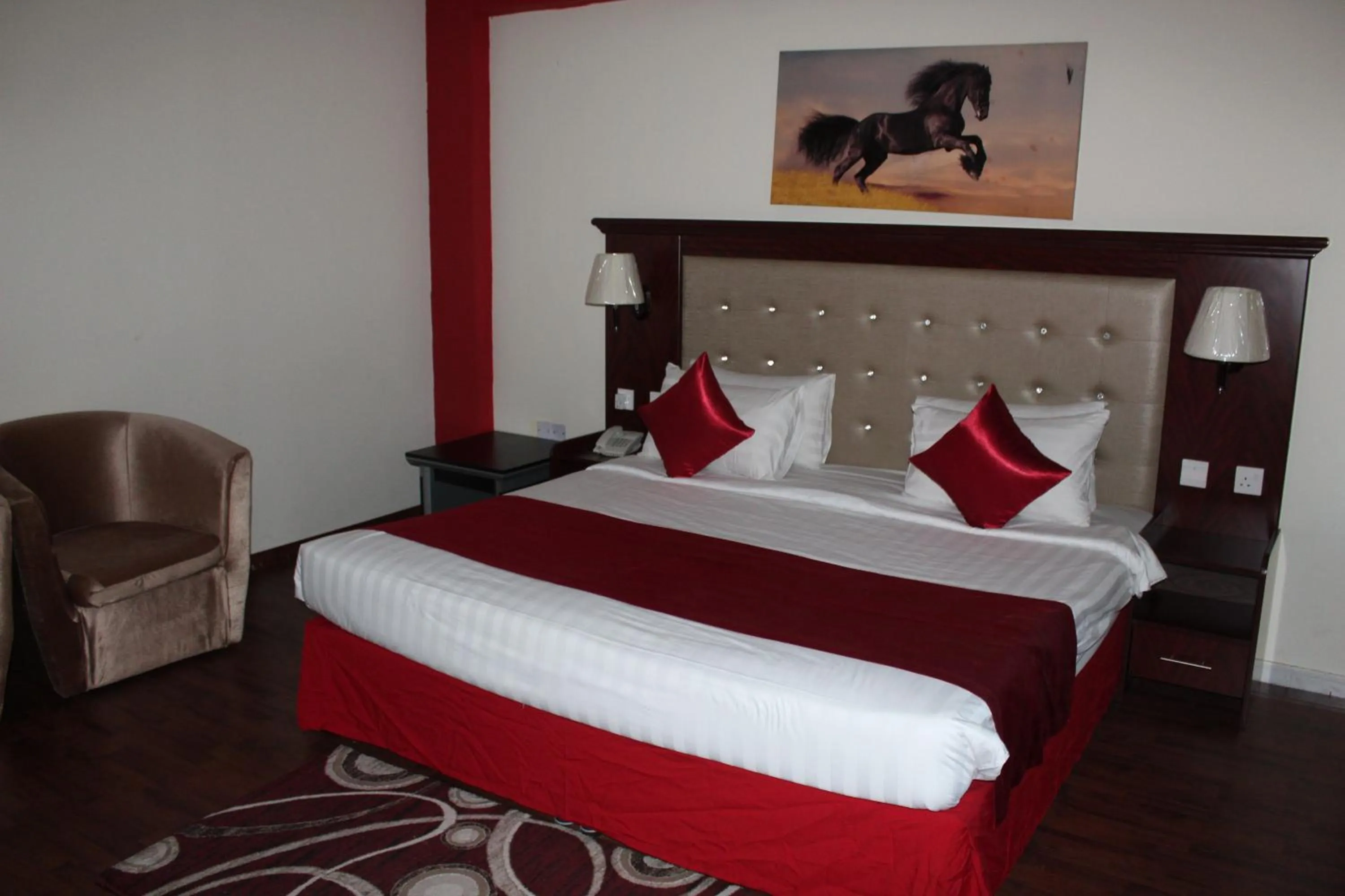 Bed in Grand Nova Hotel