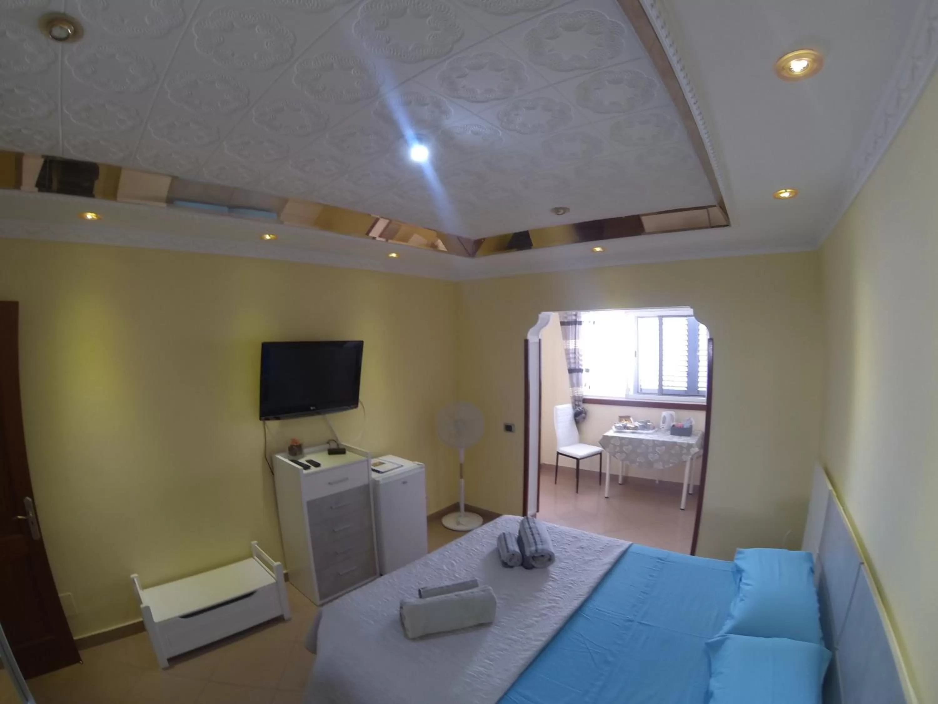 Photo of the whole room, TV/Entertainment Center in B&B Paraiso del Sol