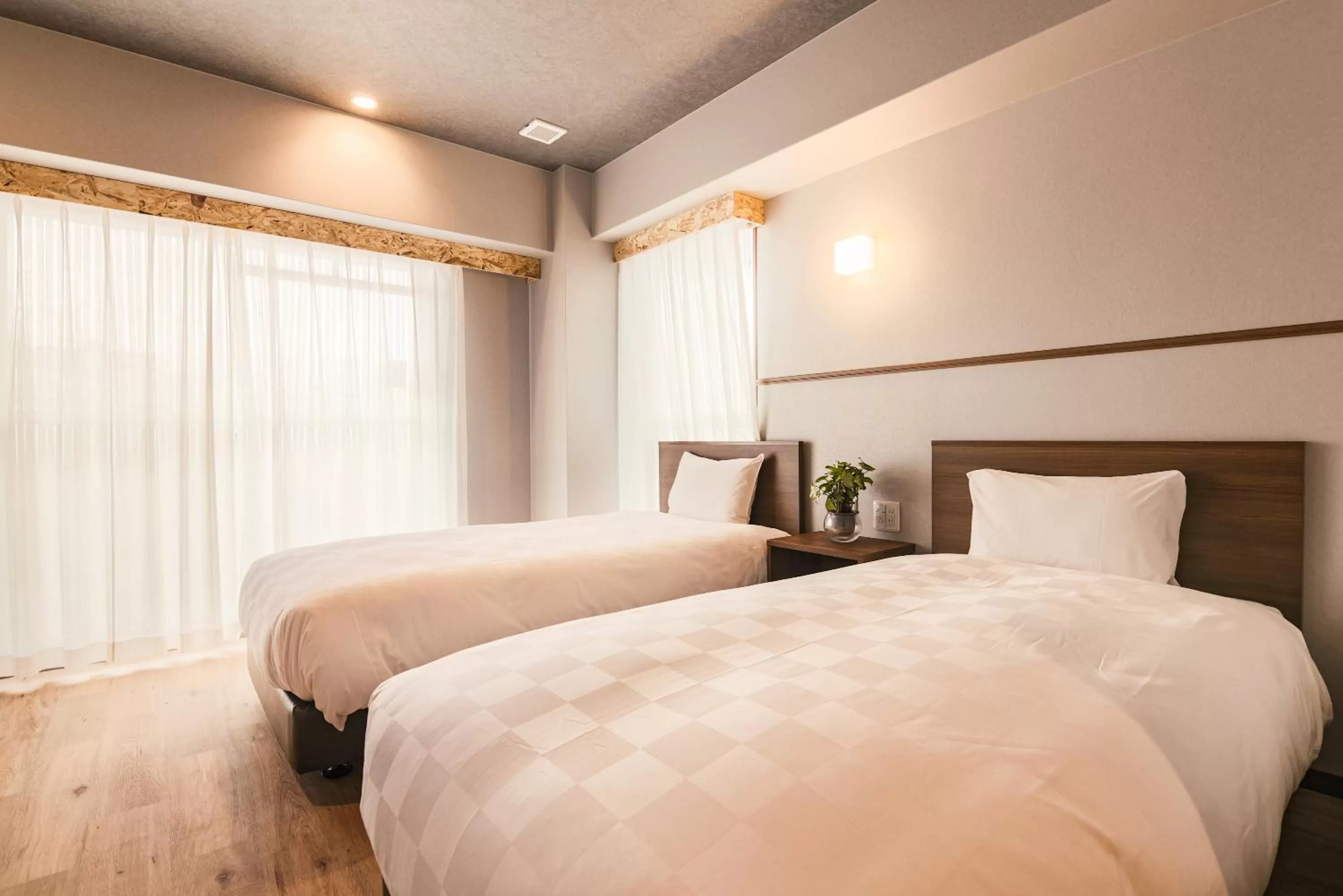 Bed in WAYFARER Kyoto Shijo